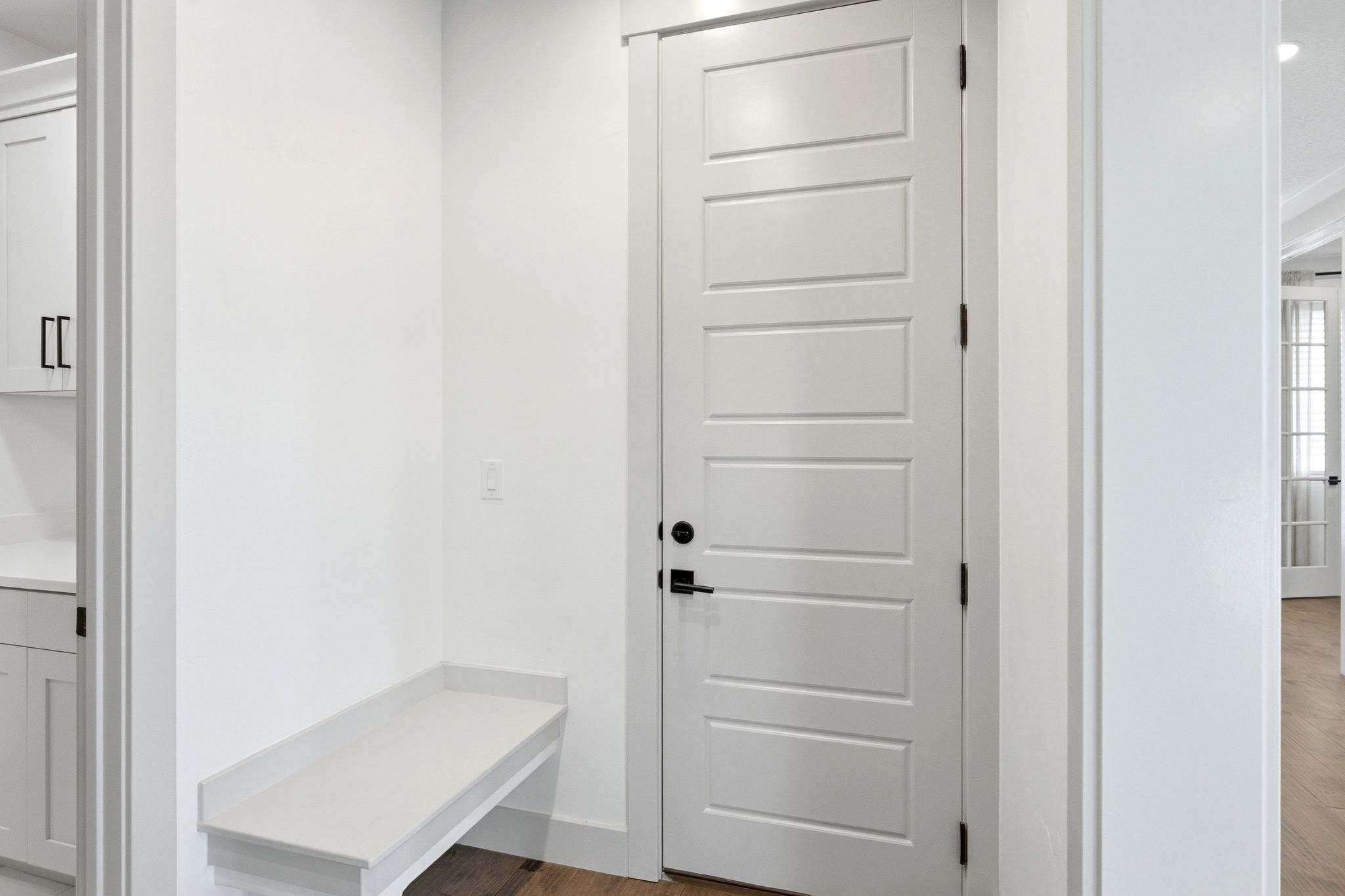 Crisp white five-panel interior door with matte black hardware