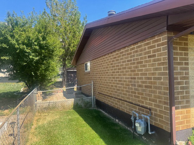 Brick exterior with brown siding