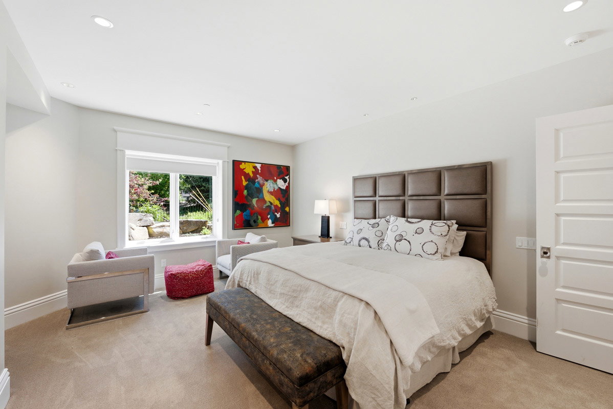 Carpeted room featuring a window with a garden view, a paneled door, recessed lighting, and crown molding