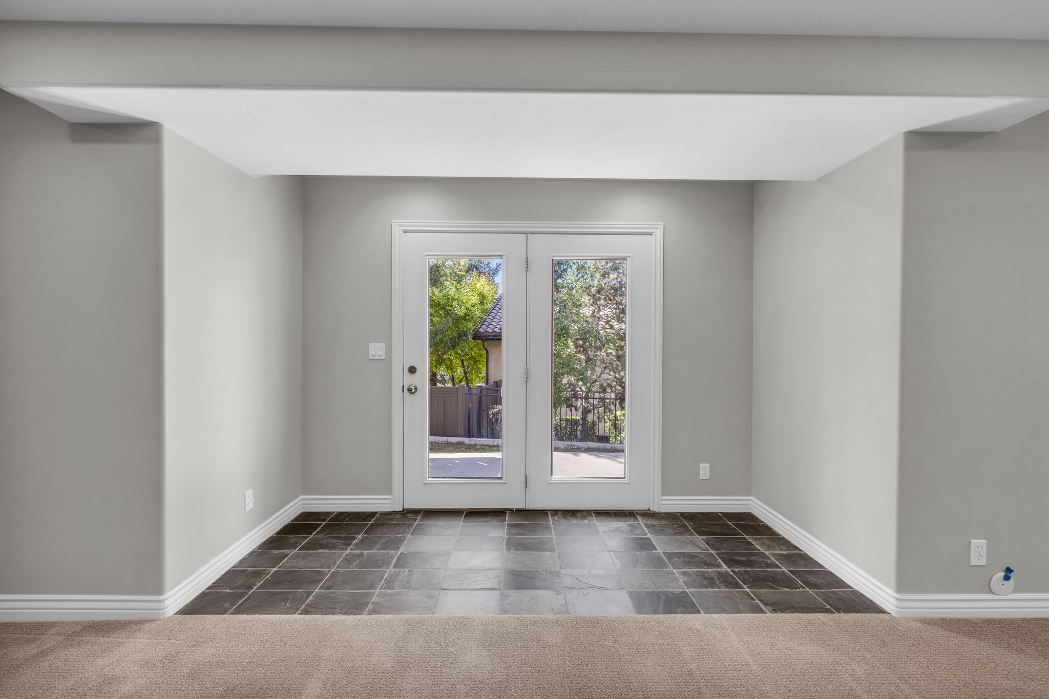 Double French doors out of lower level