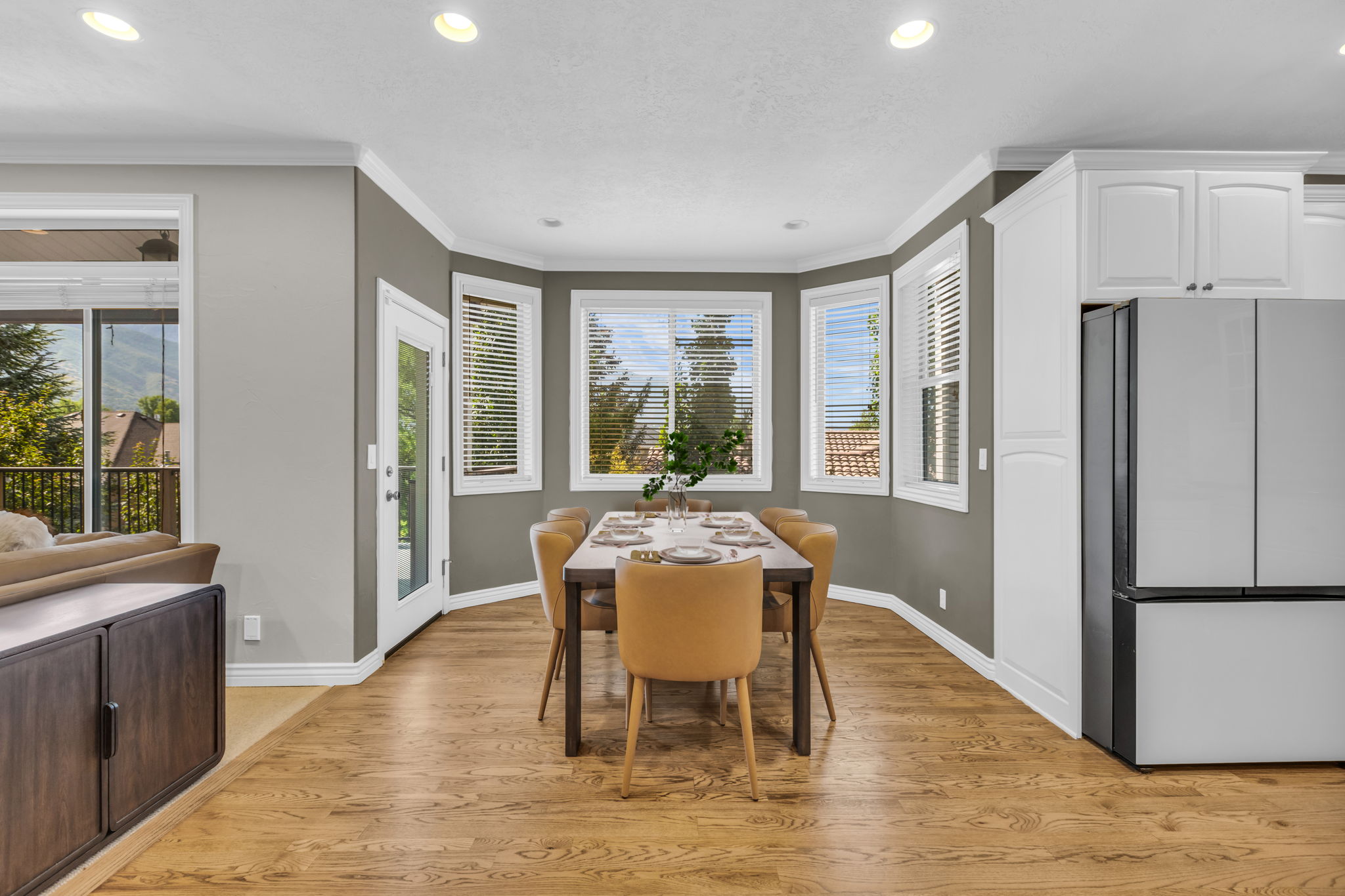 Dining area featuring a bay window, recessed lighting, and wood-finish flooring