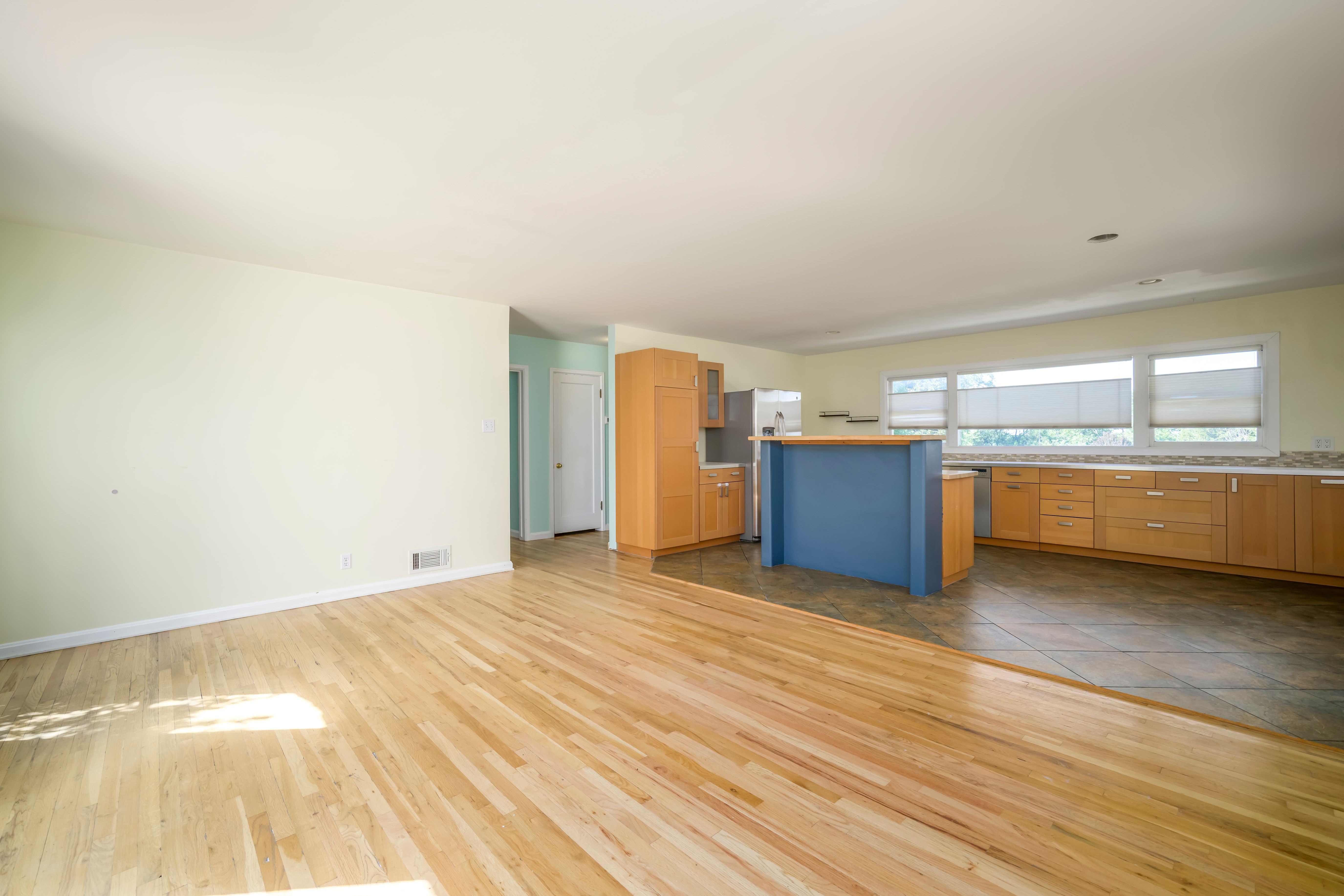 Bright living area featuring wood-finish flooring