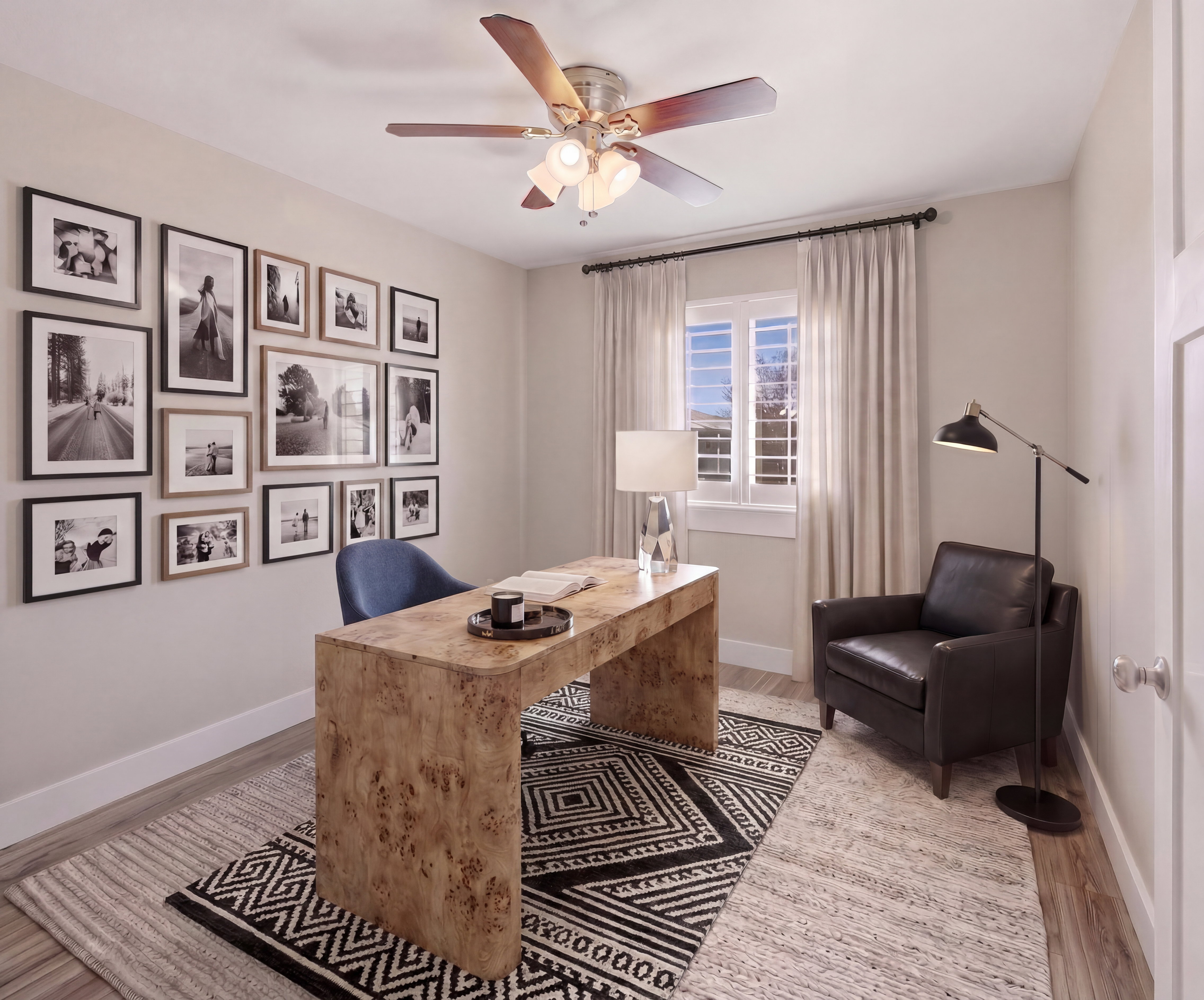 Light-filled room featuring wood-finish flooring, a ceiling fan with integrated lighting, and a window with white shutters