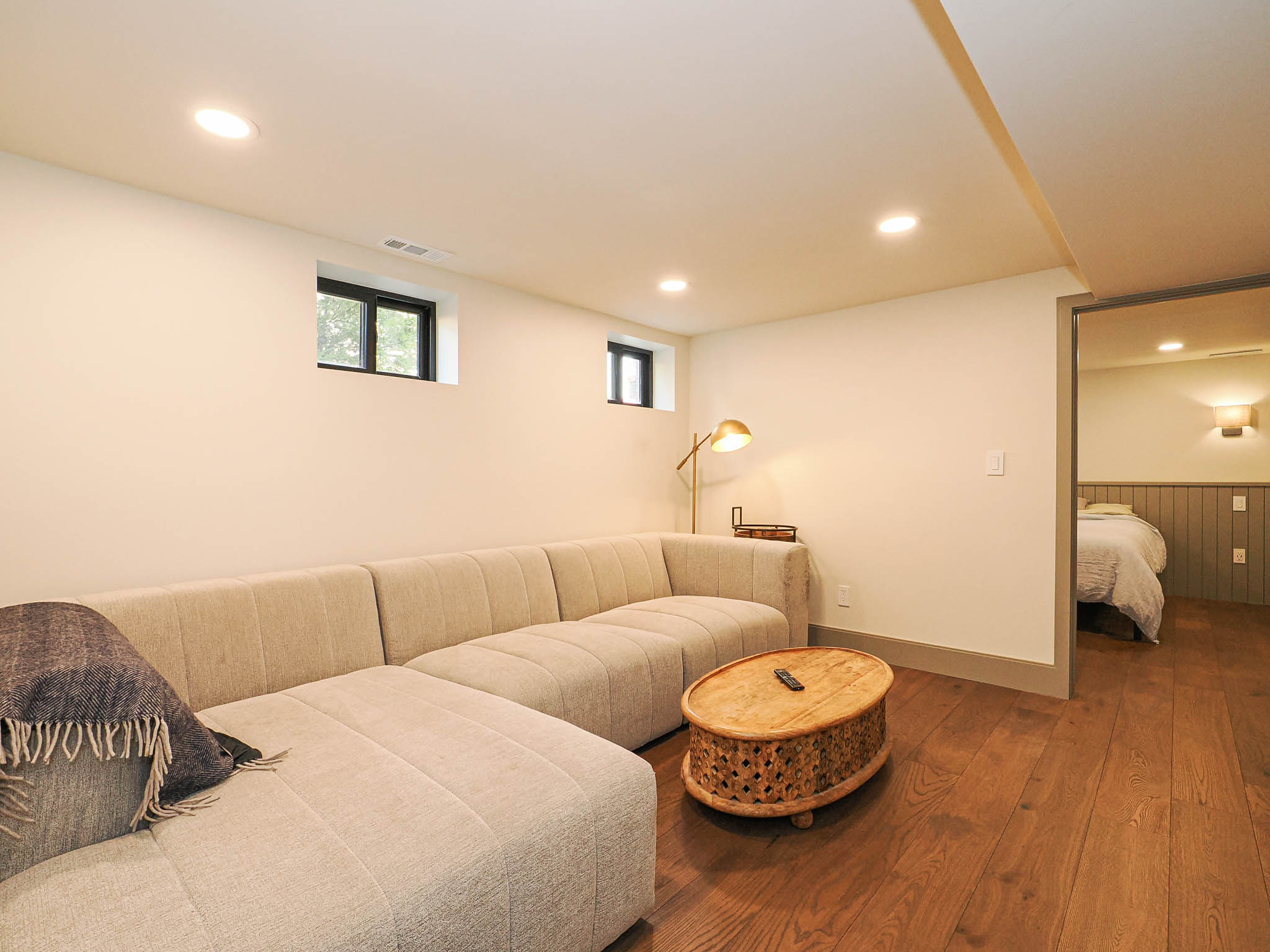 Recreational room featuring recessed lighting, wood-finish flooring, and white walls