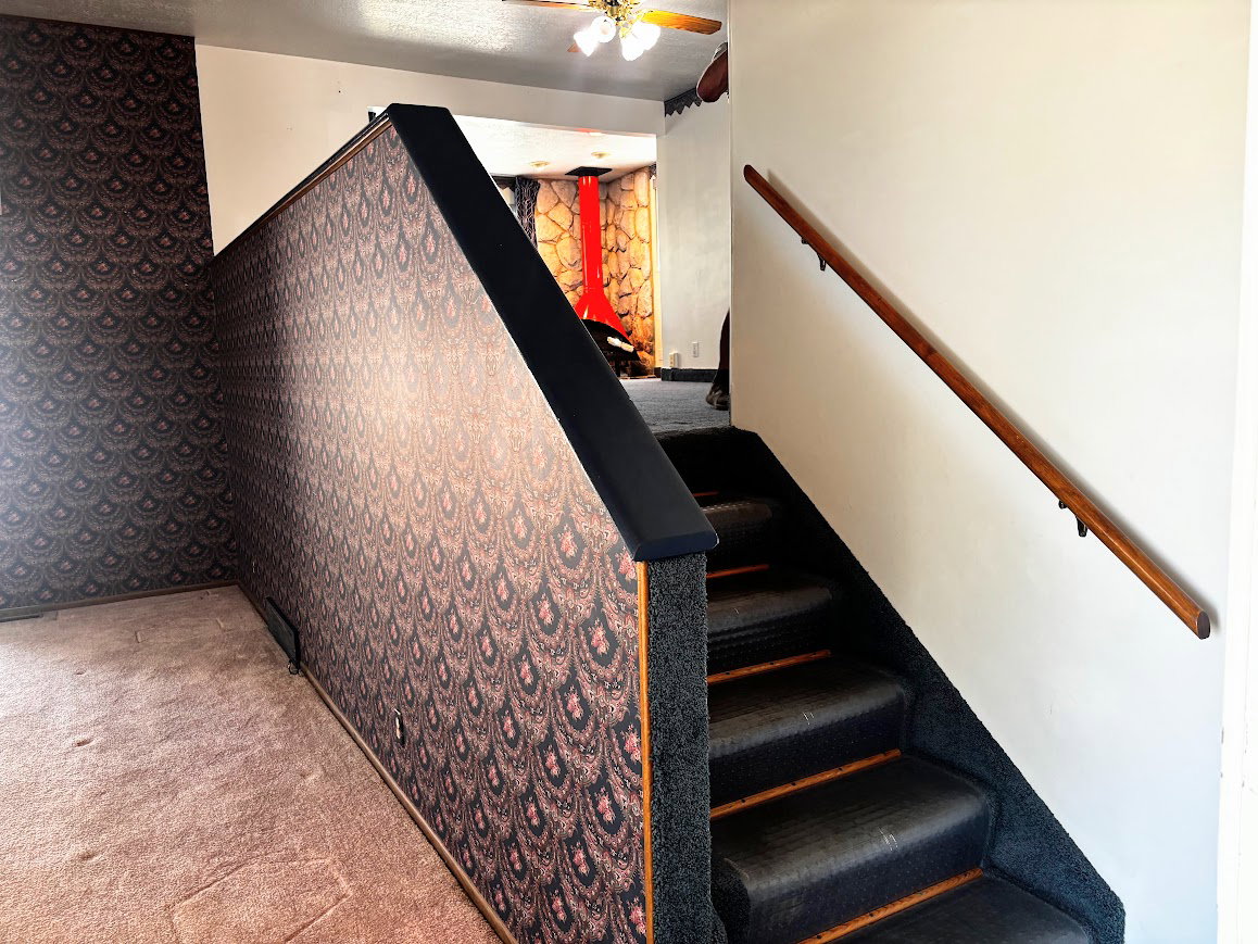 Stairs leading up to the kitchen/dining