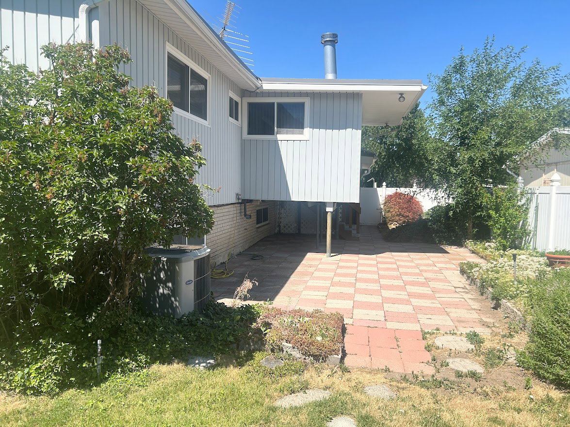 Side yard leading to the covered patio