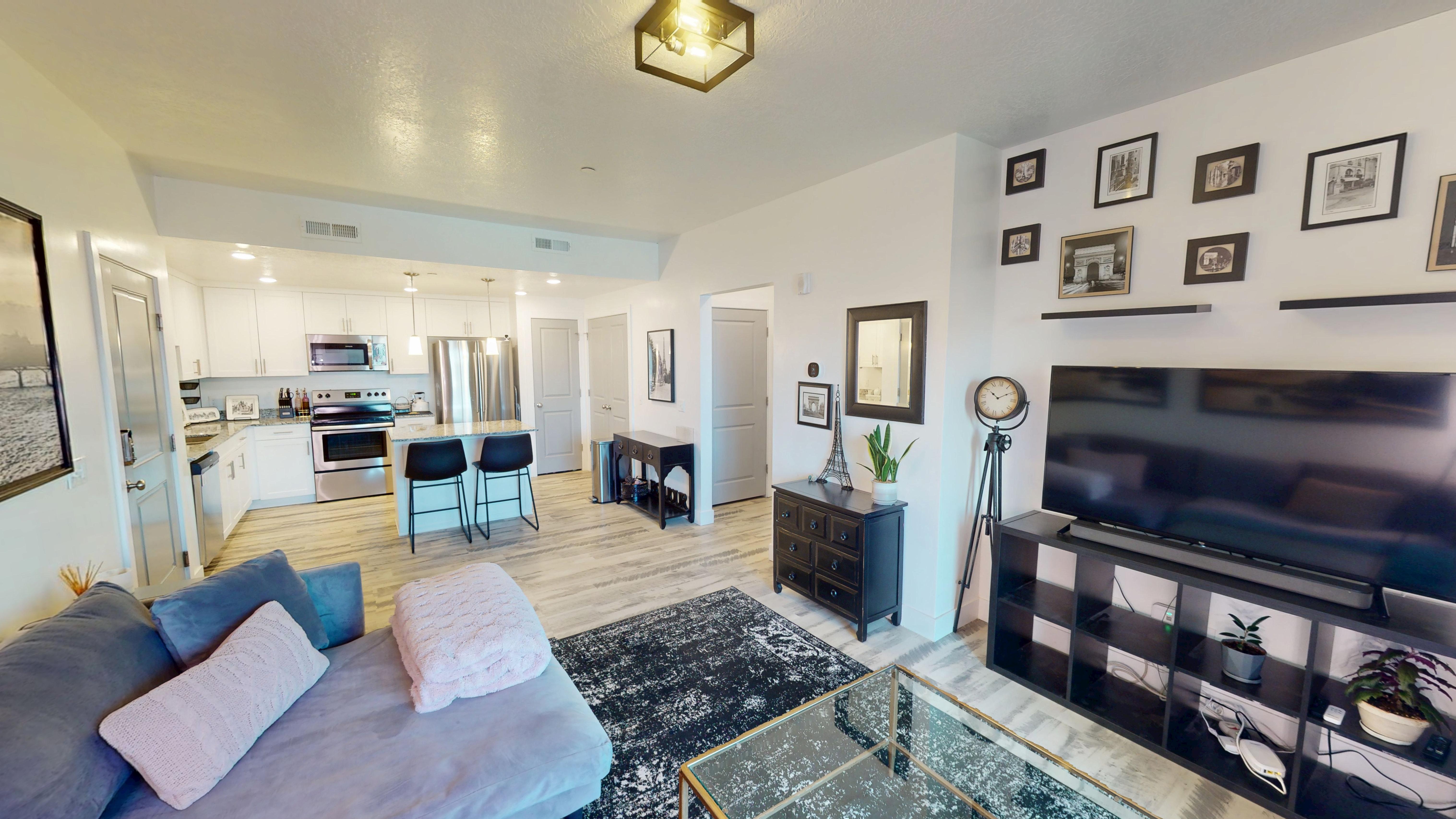 Open-concept living area featuring light wood-finish flooring throughout