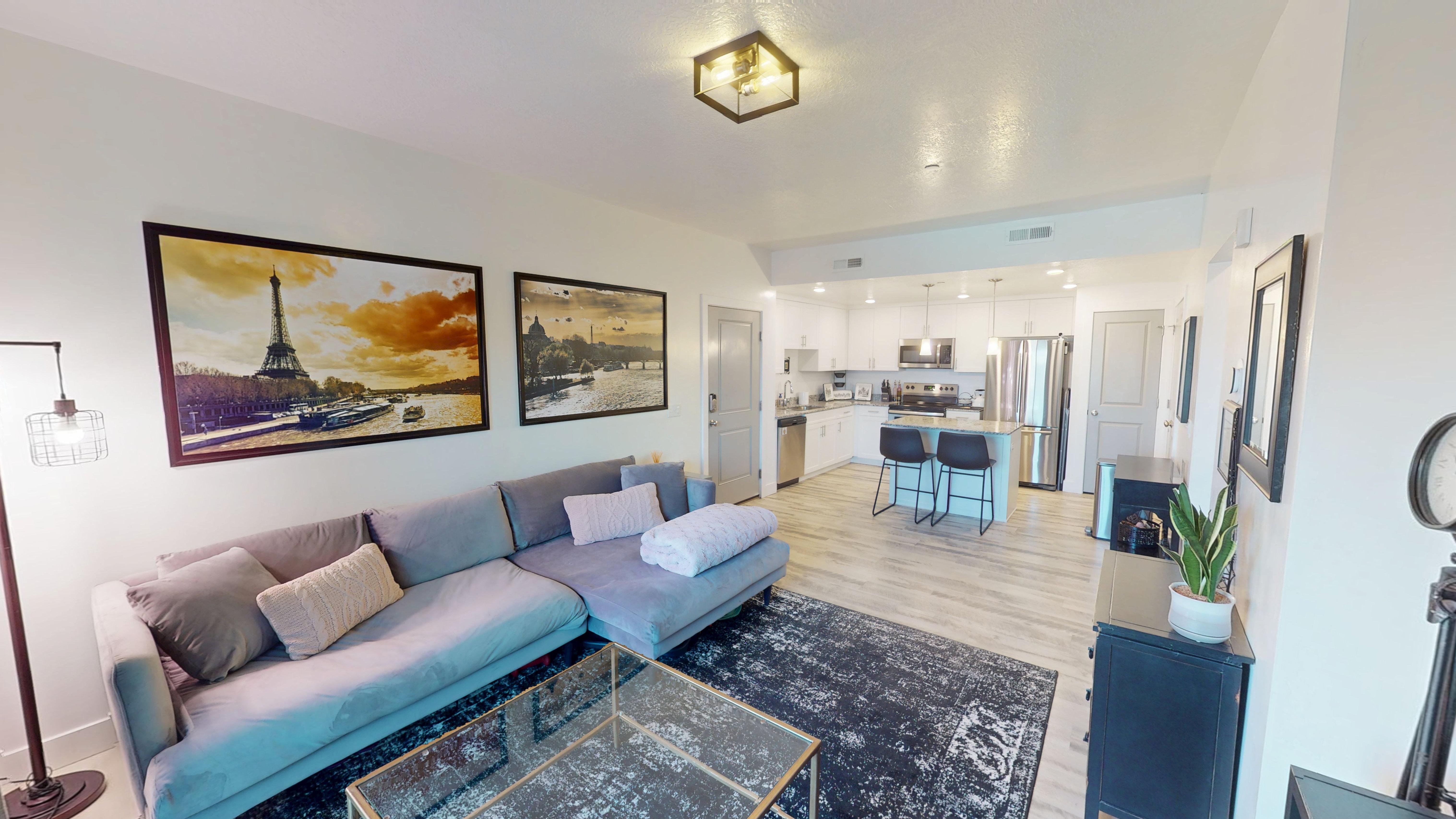 Open-concept living space featuring wood-finish flooring