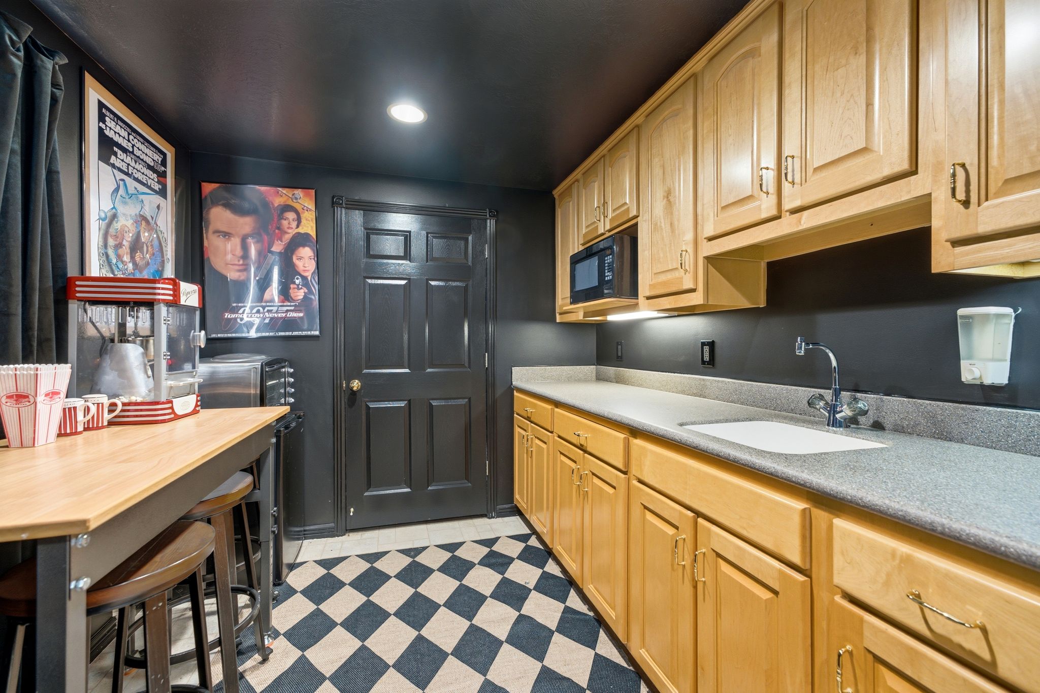 Entertainment space featuring black and white checkerboard flooring