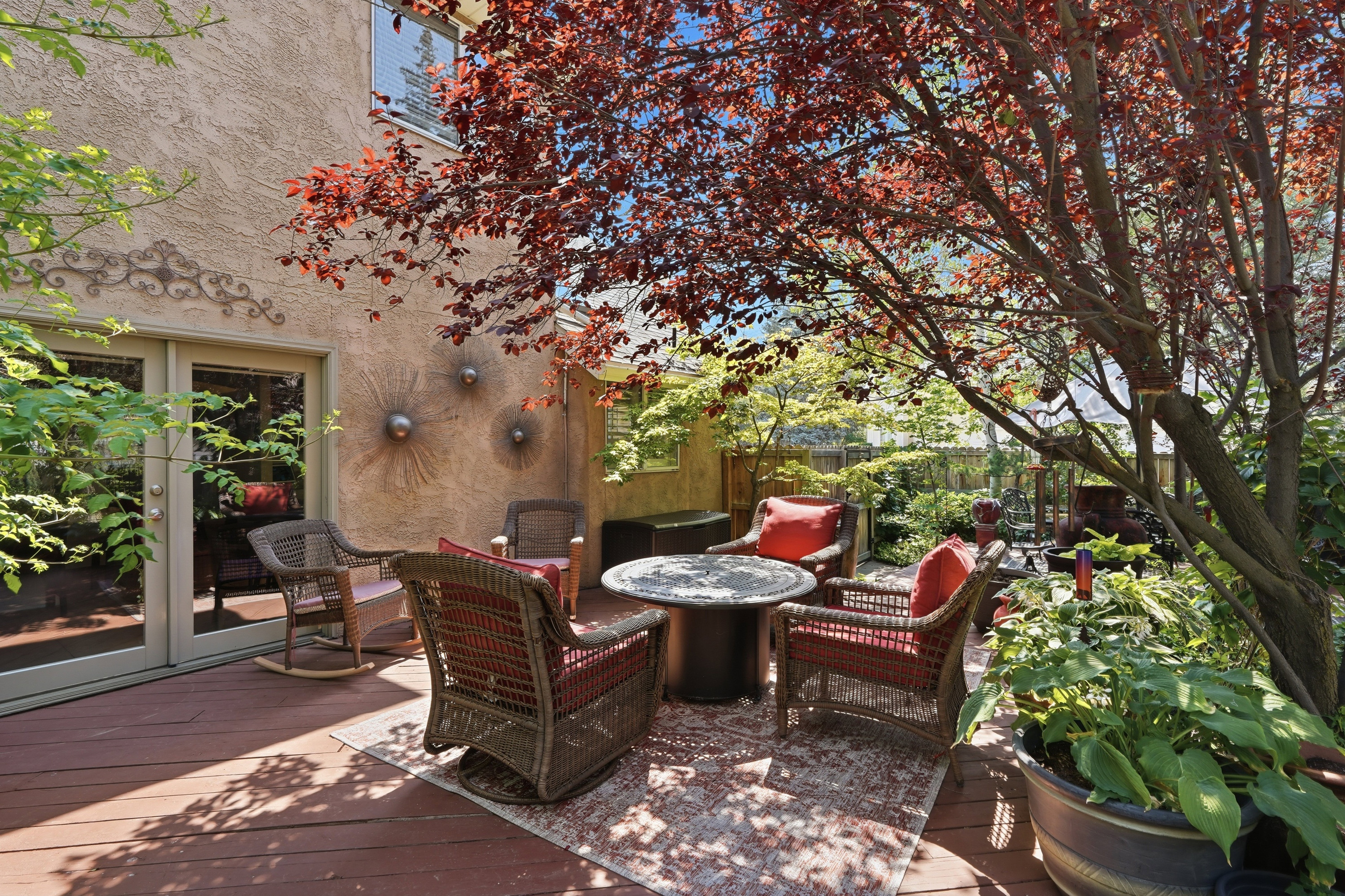 Another view of seating area in lovely backyard