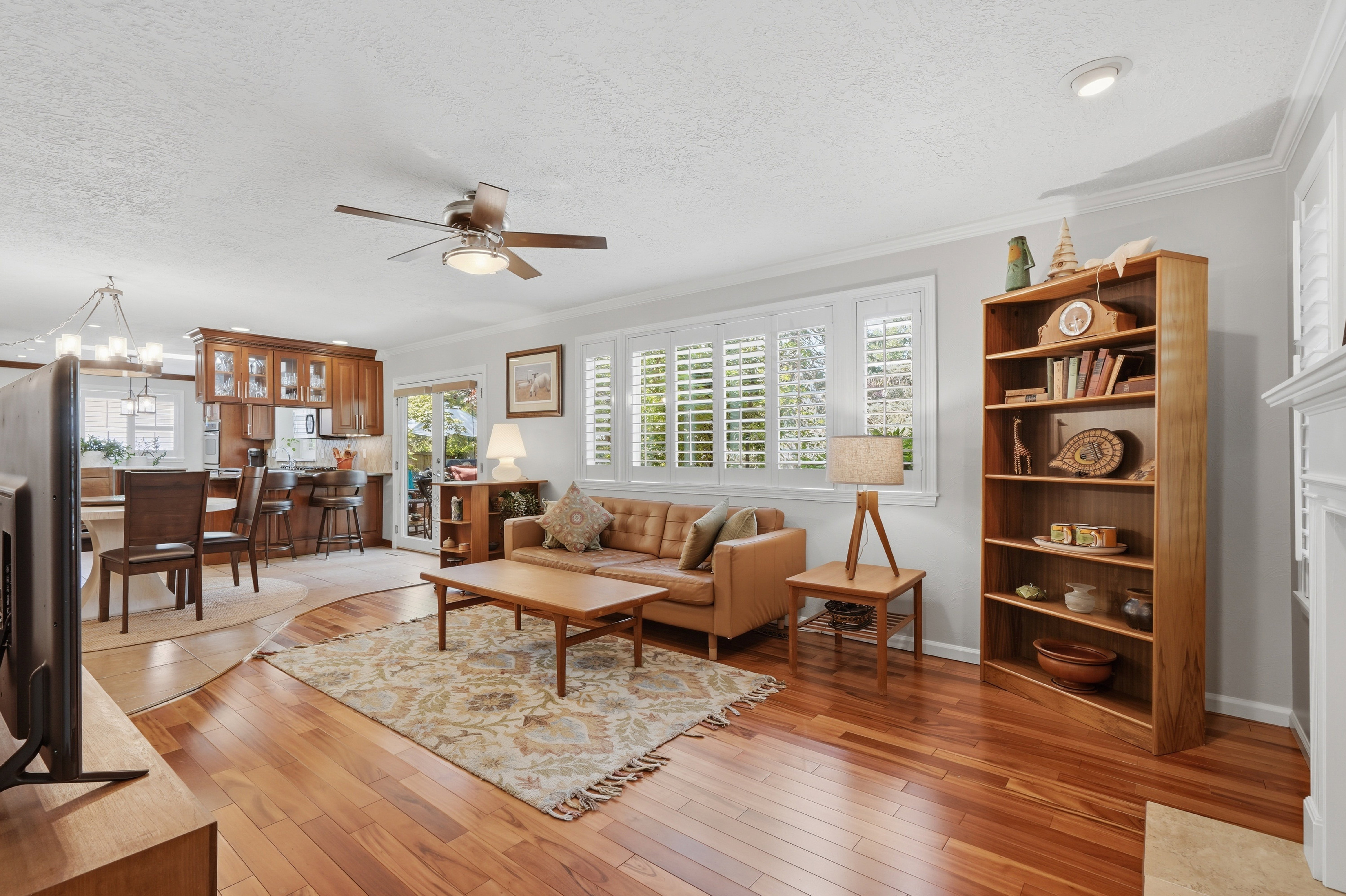 Another view of Family Room w/ white plantation shutters