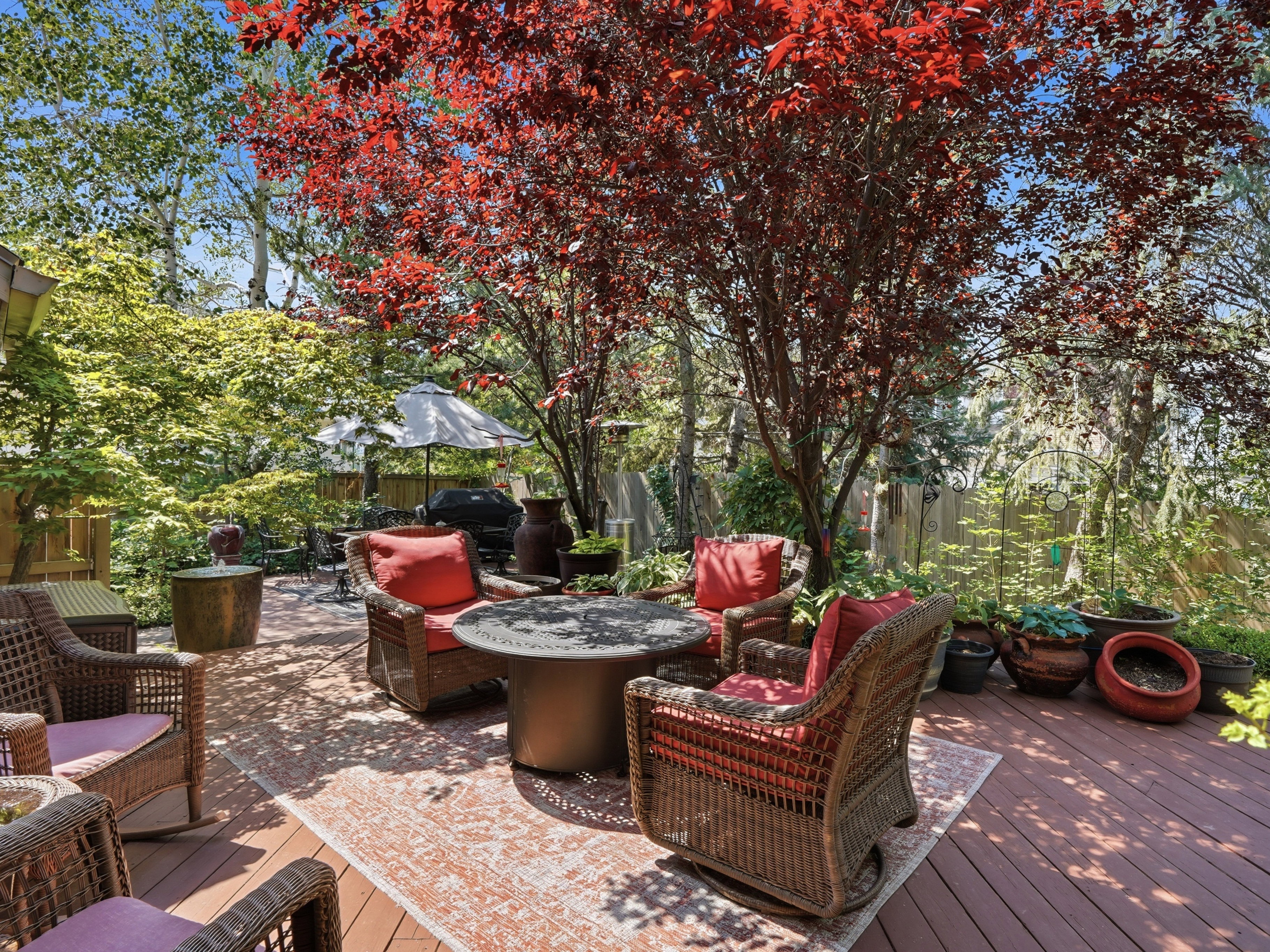 Another view of seating area in lovely backyard