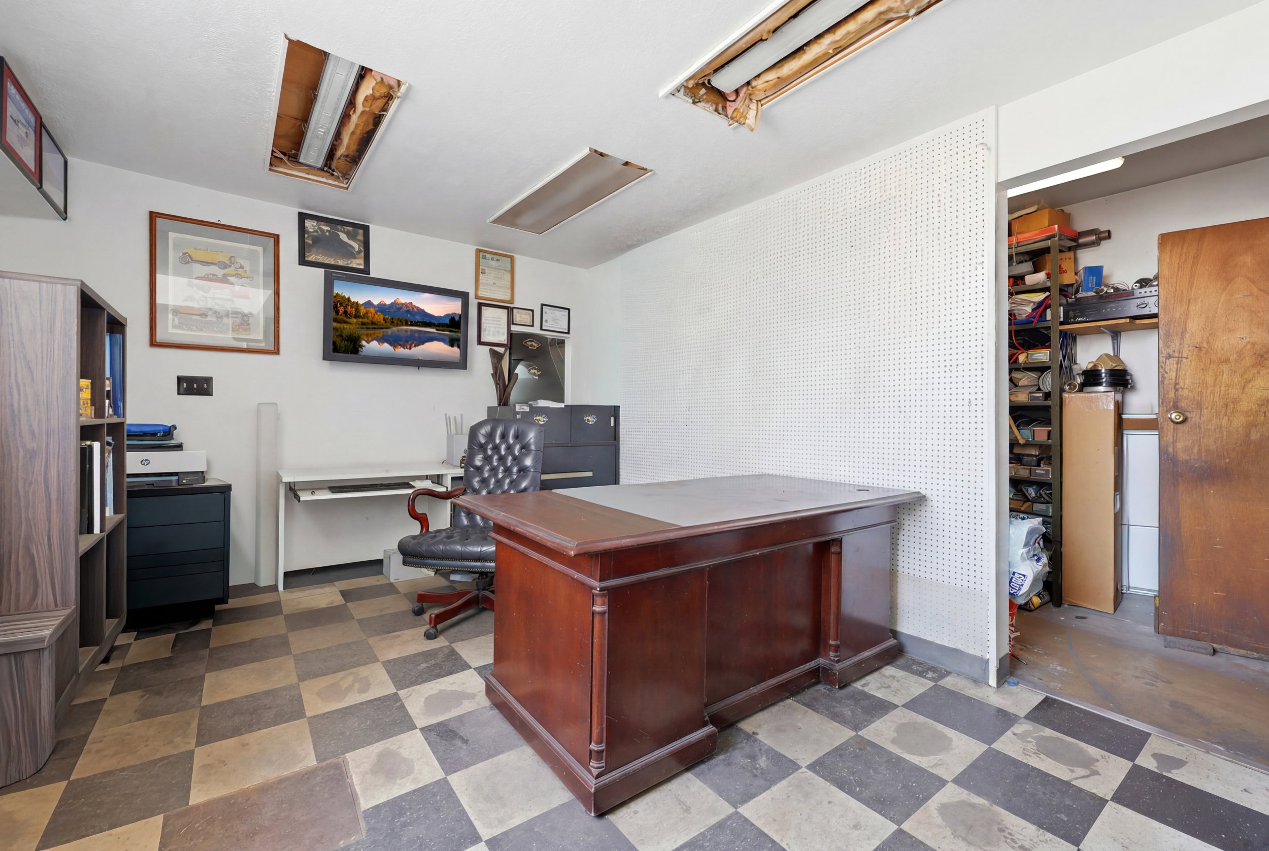 Room featuring checkered flooring and white walls