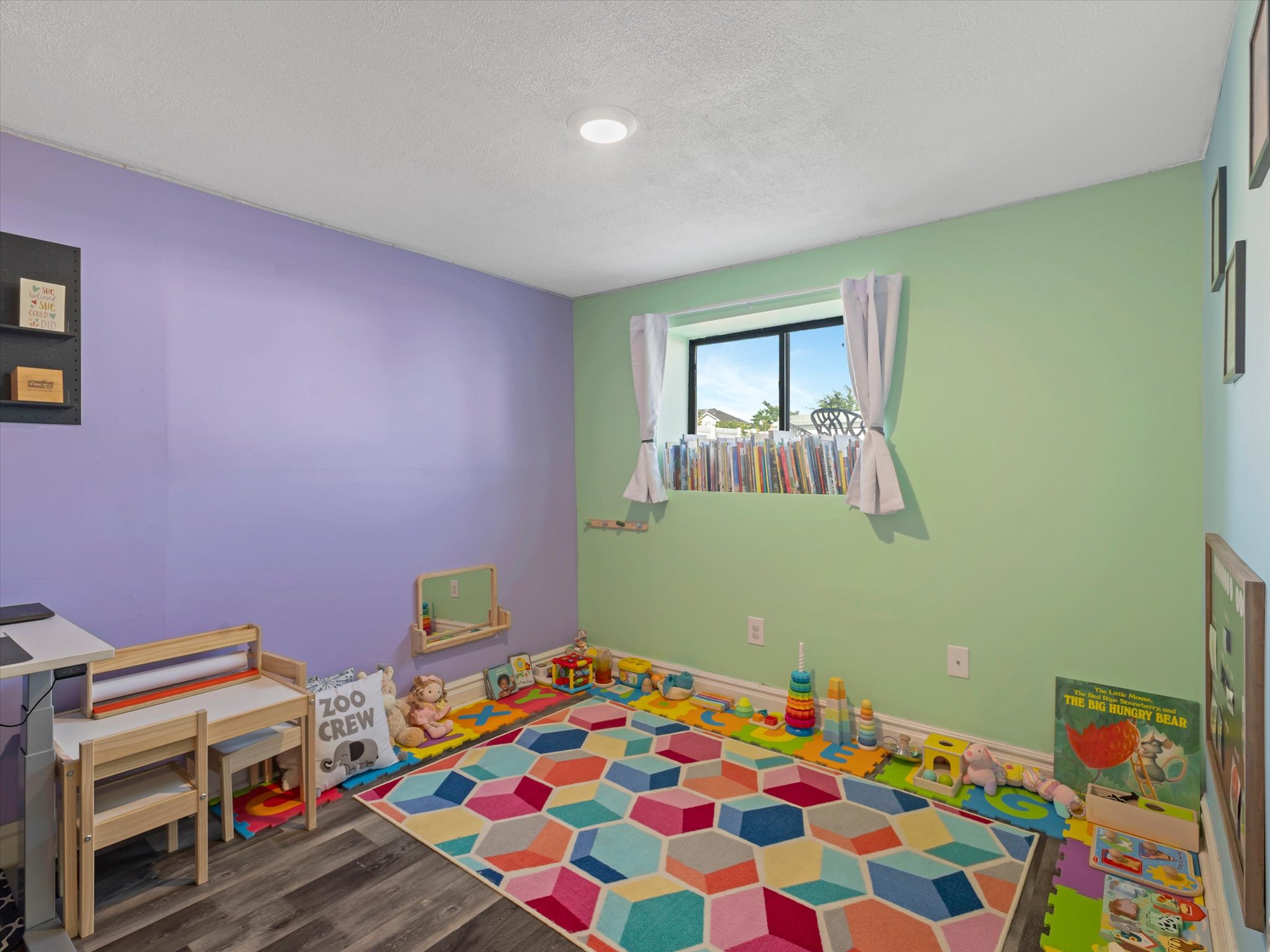 Room featuring wood-finish flooring and a recessed ceiling light
