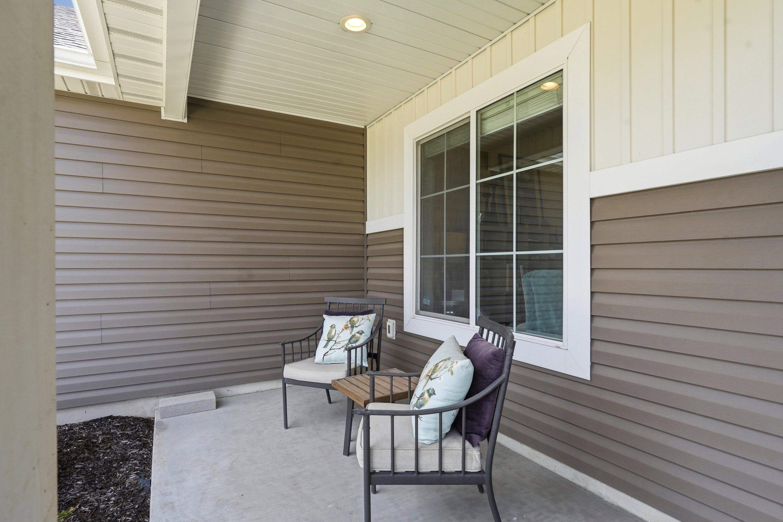 Covered patio featuring concrete flooring and a recessed ceiling light