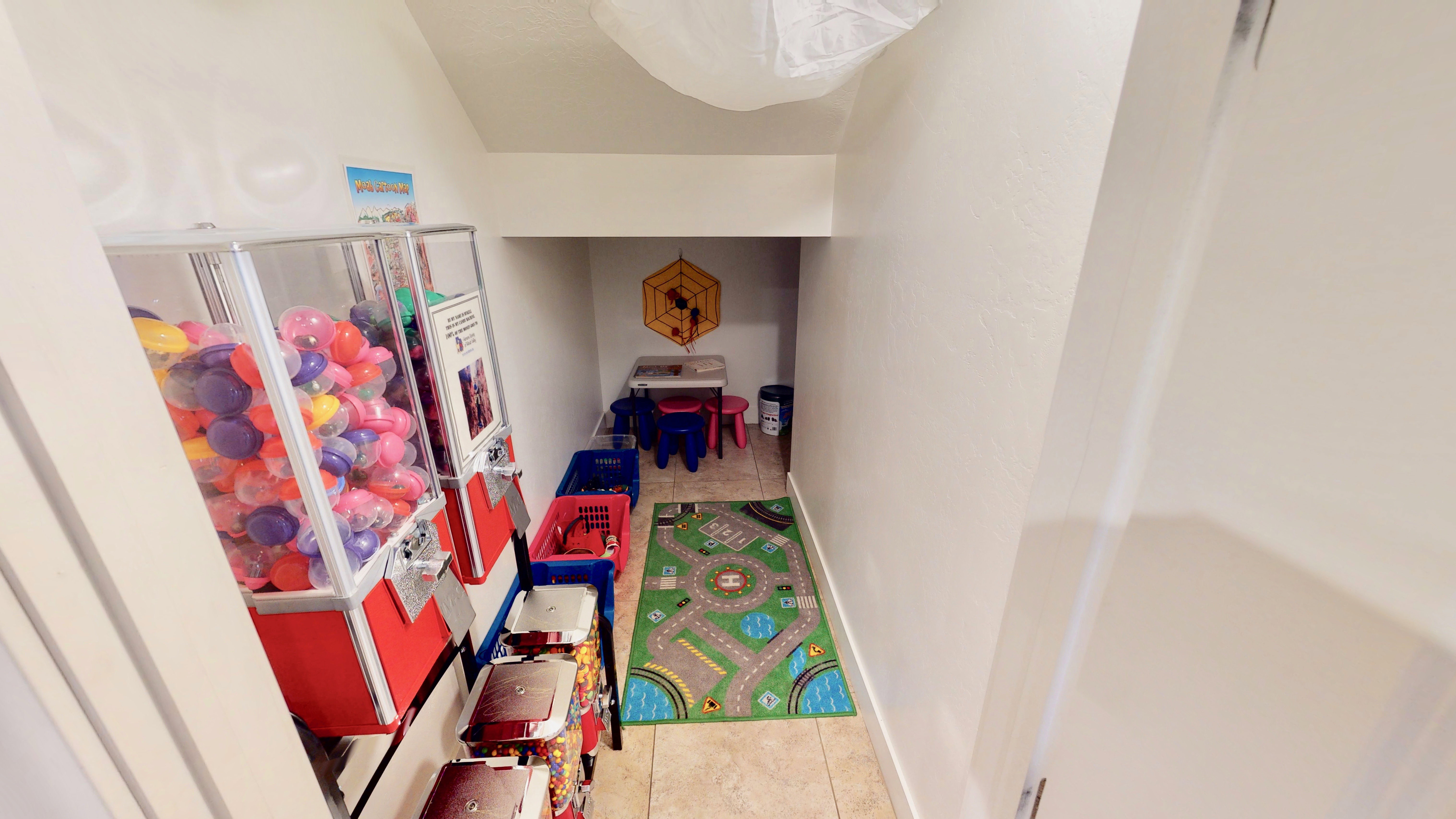 Recessed alcove featuring a tiled floor and painted walls