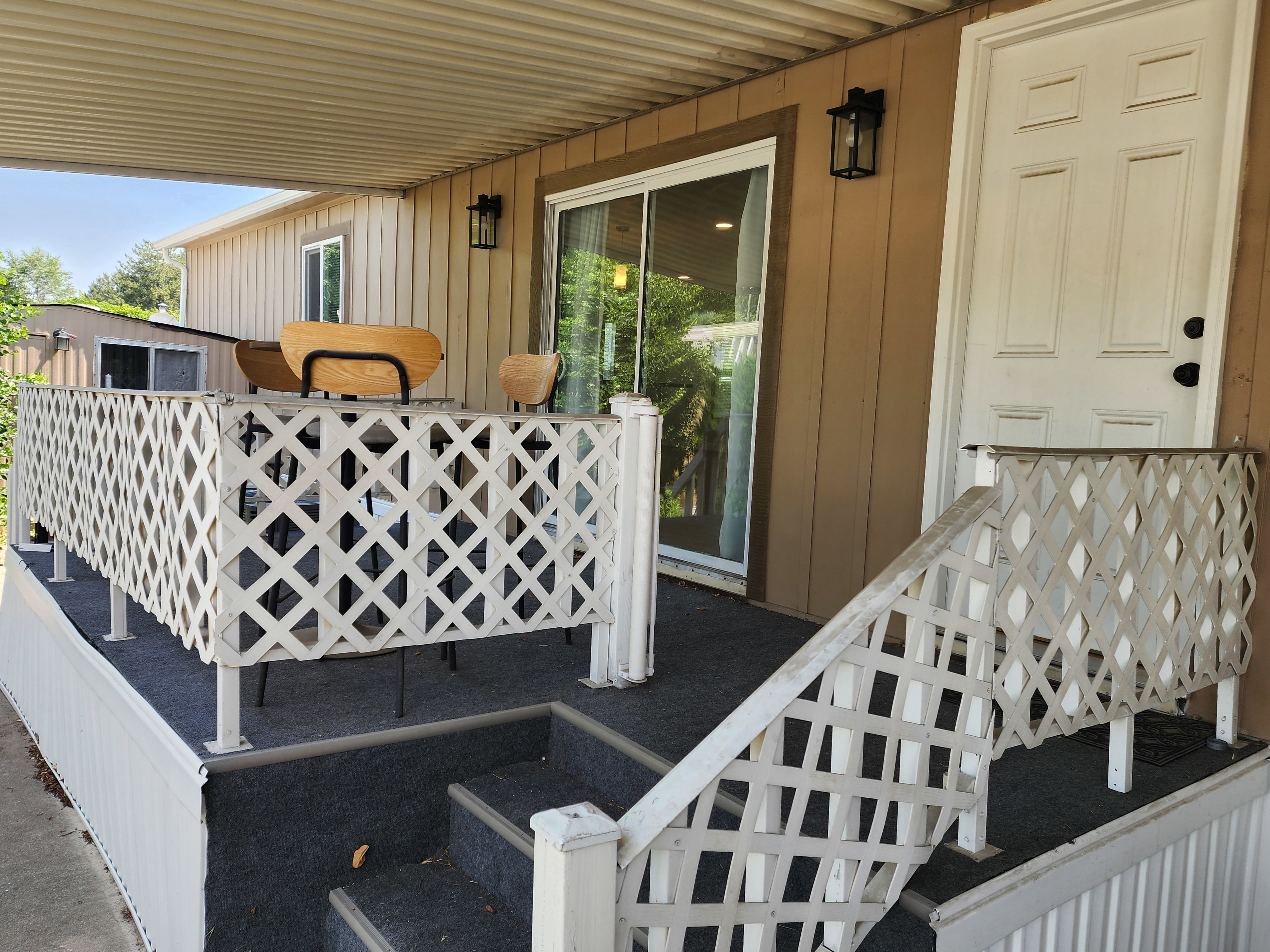 Covered porch with carpeted flooring