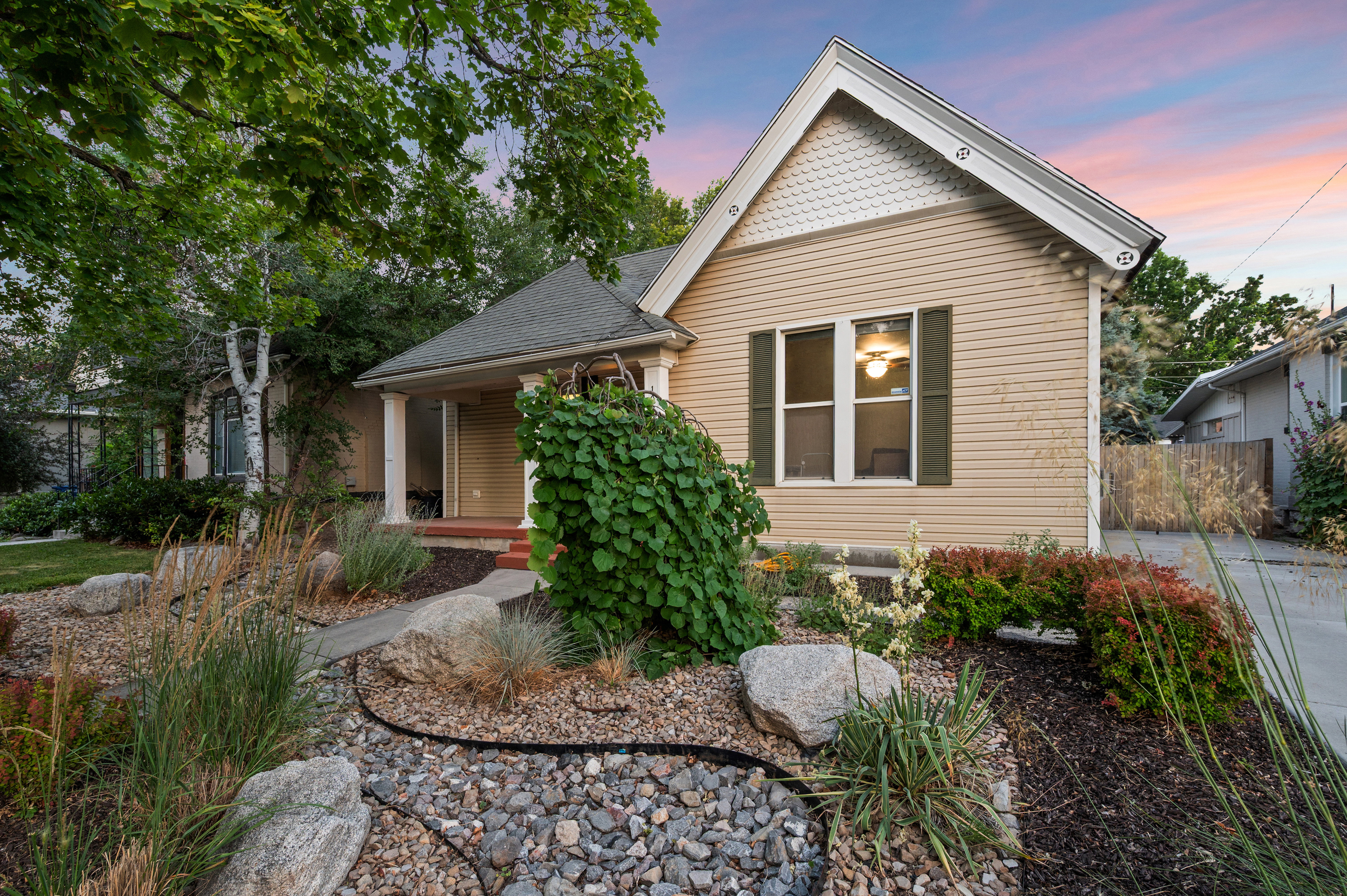 Charming exterior with horizontal siding and decorative gable shingle siding
