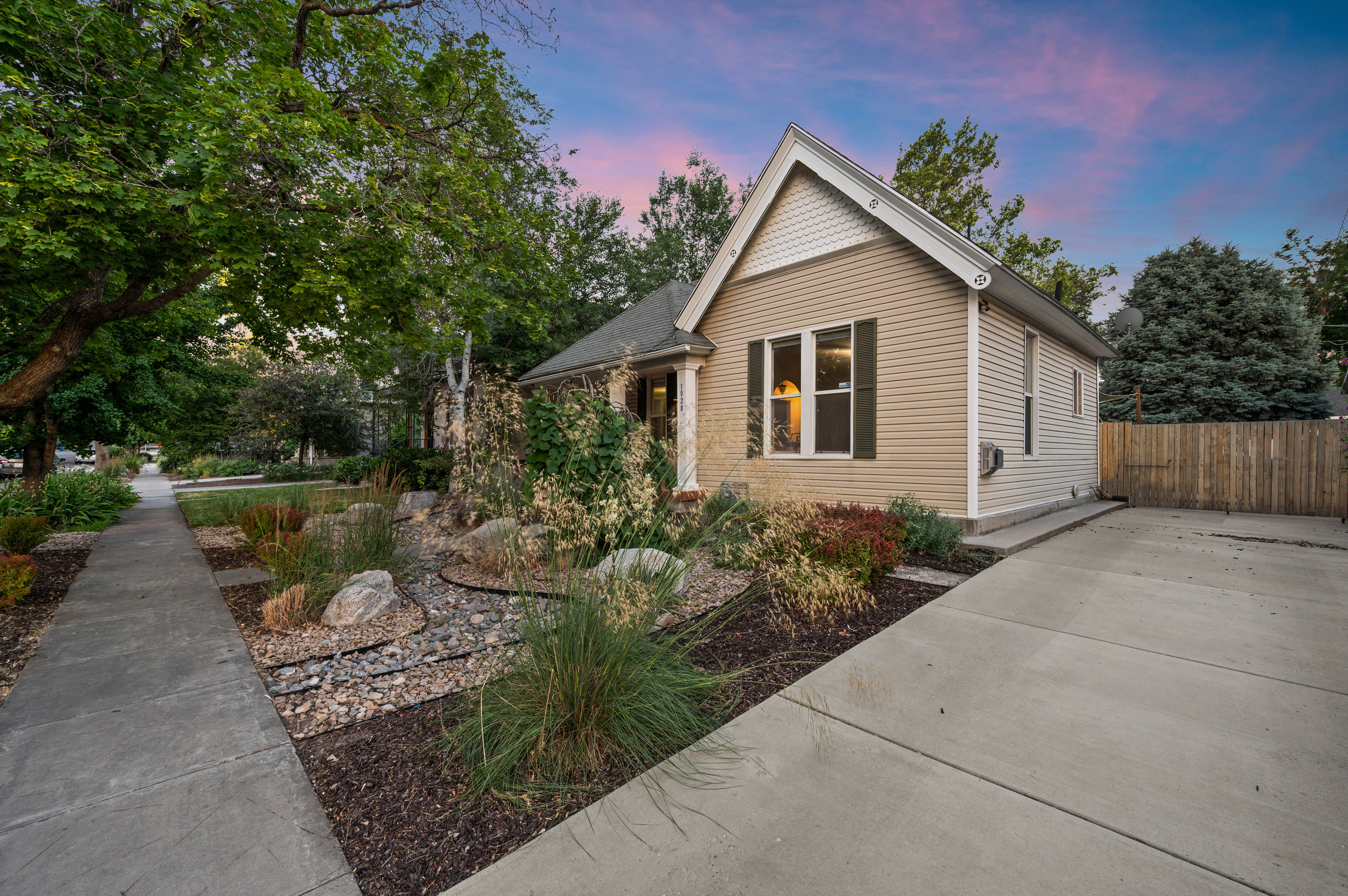 Exterior siding with architectural gables and dark shutters
