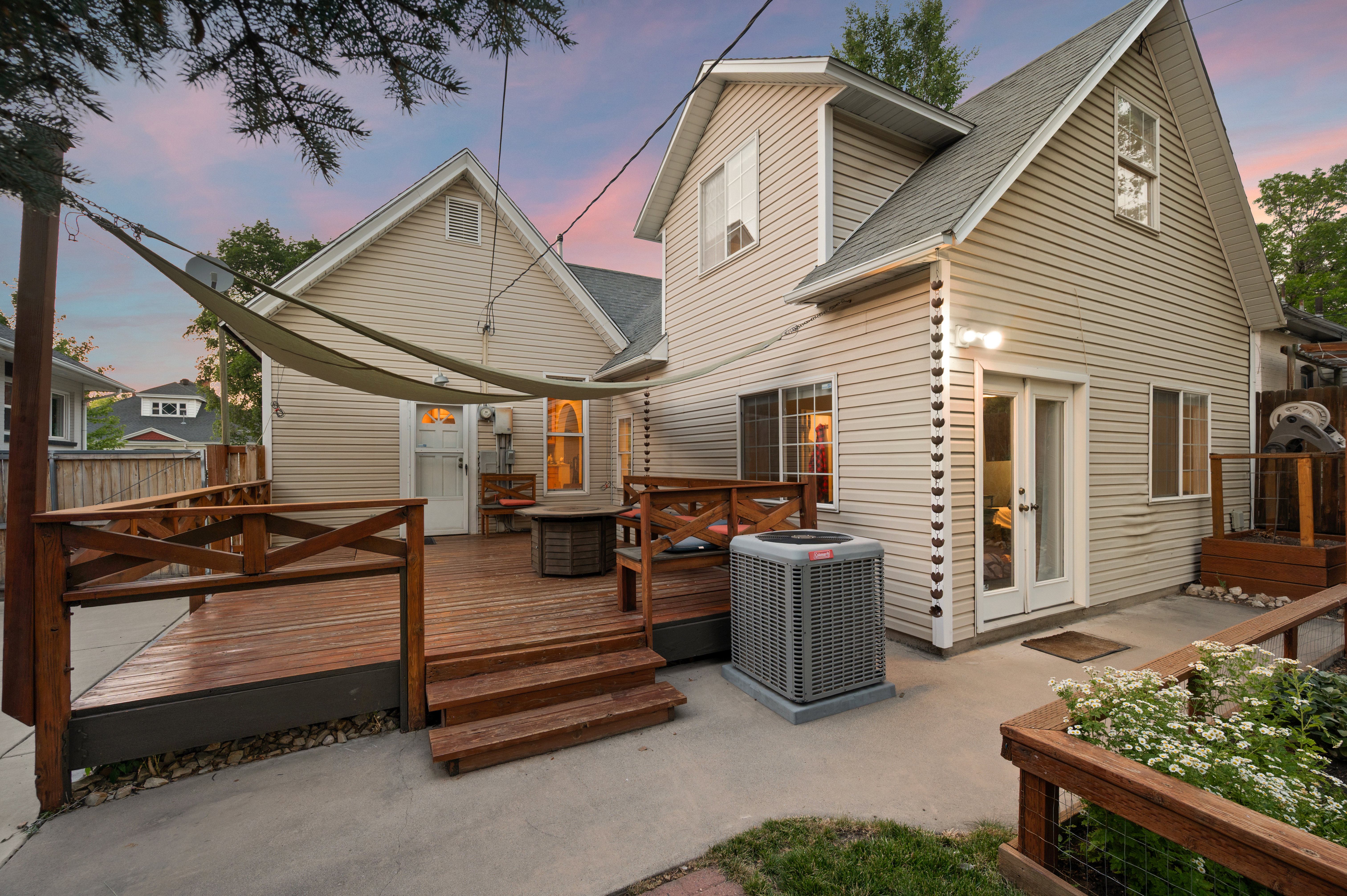 Multi-level deck with wood railing, offering a private outdoor living space