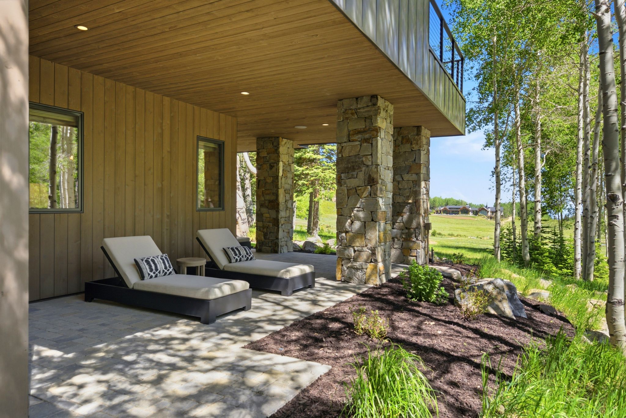 Covered patio featuring a concrete surface, wood panel ceiling, and recessed lighting