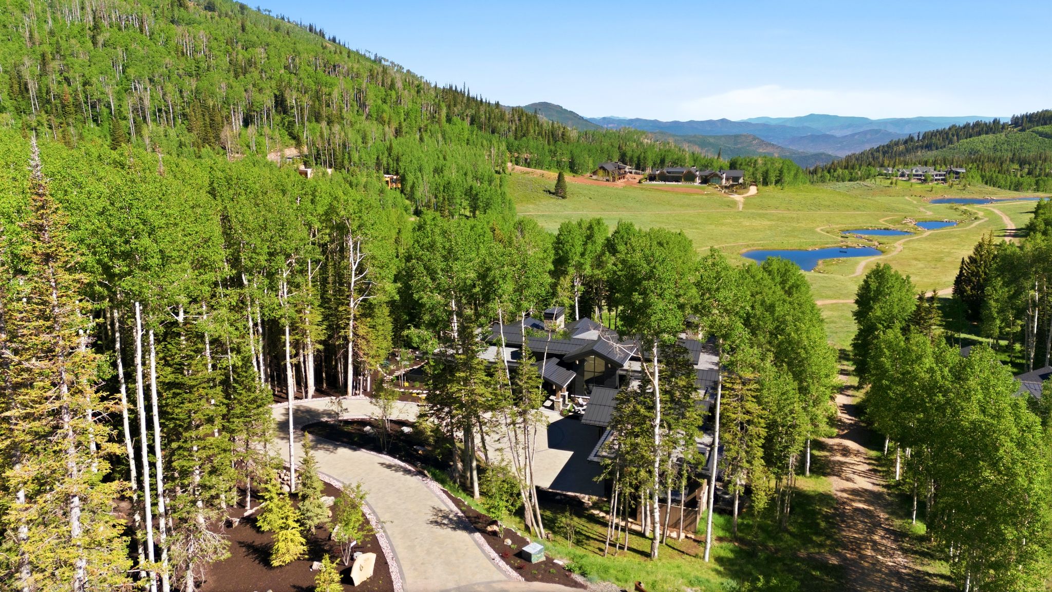 Contemporary mountain residence nestled among mature trees