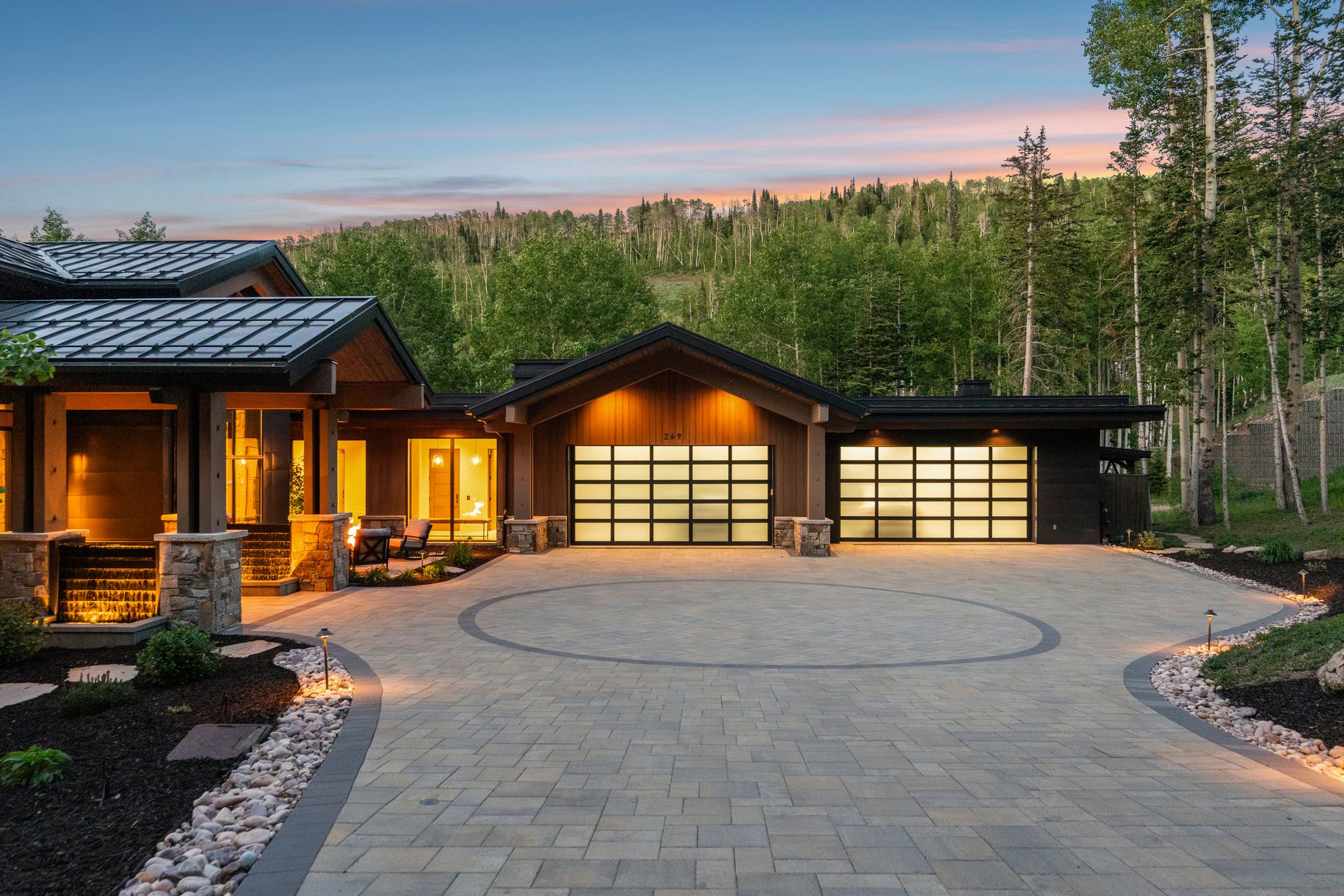 Contemporary architectural design featuring stone accents and wood siding