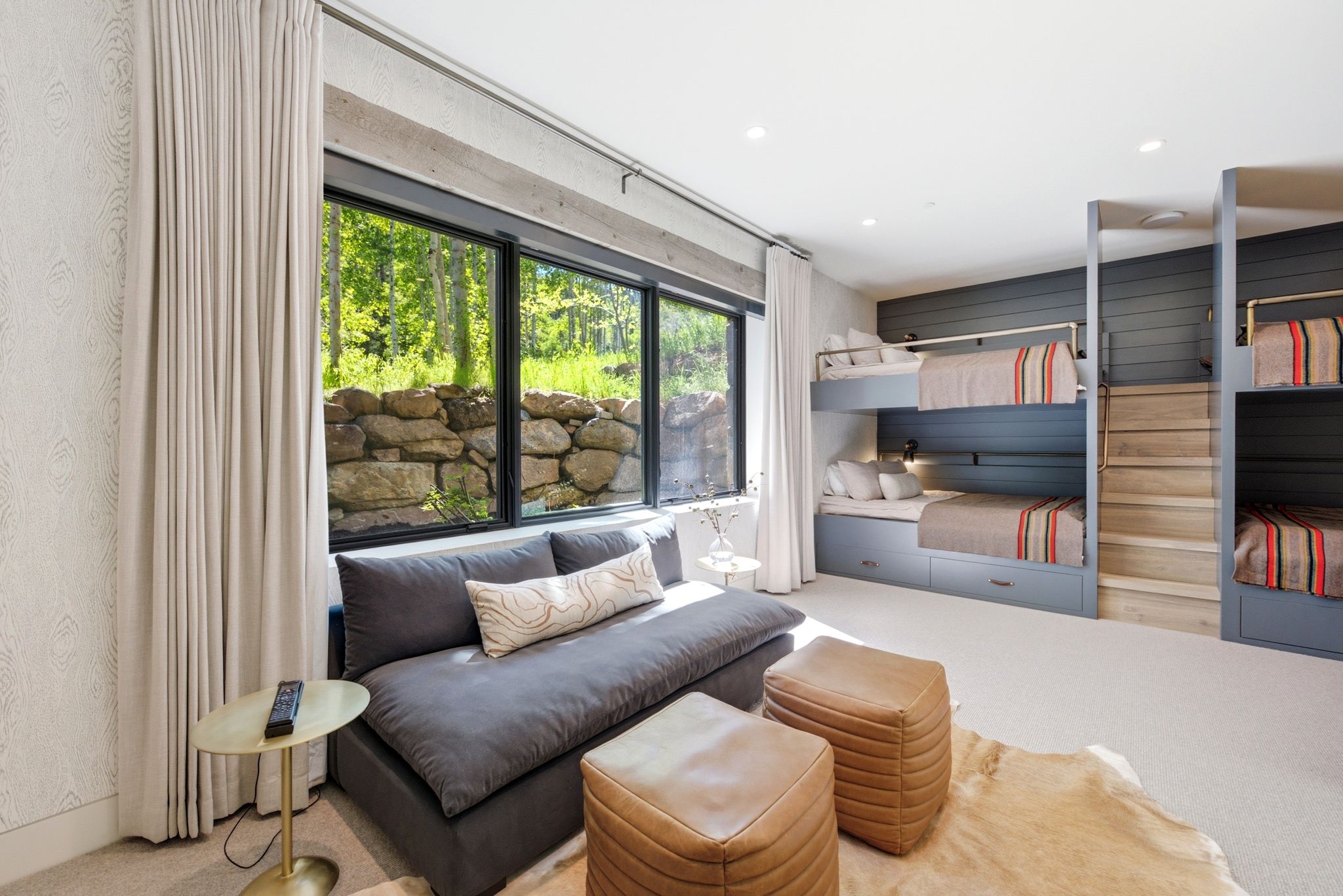 Room featuring built-in bunk beds with integrated storage, large full-wall windows, recessed lighting, and light-toned carpeting