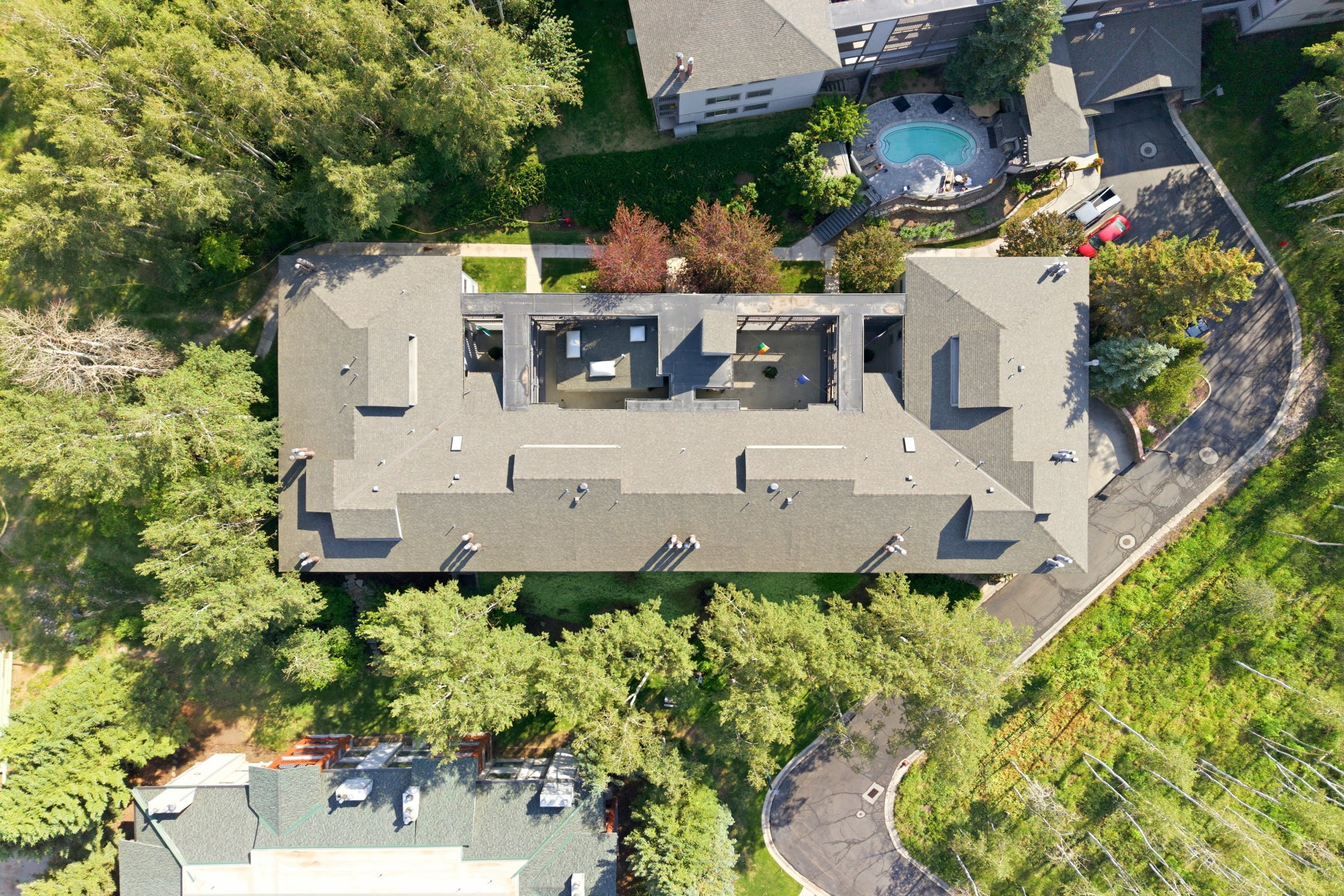 Multi-unit property featuring a complex roofline and multiple courtyards