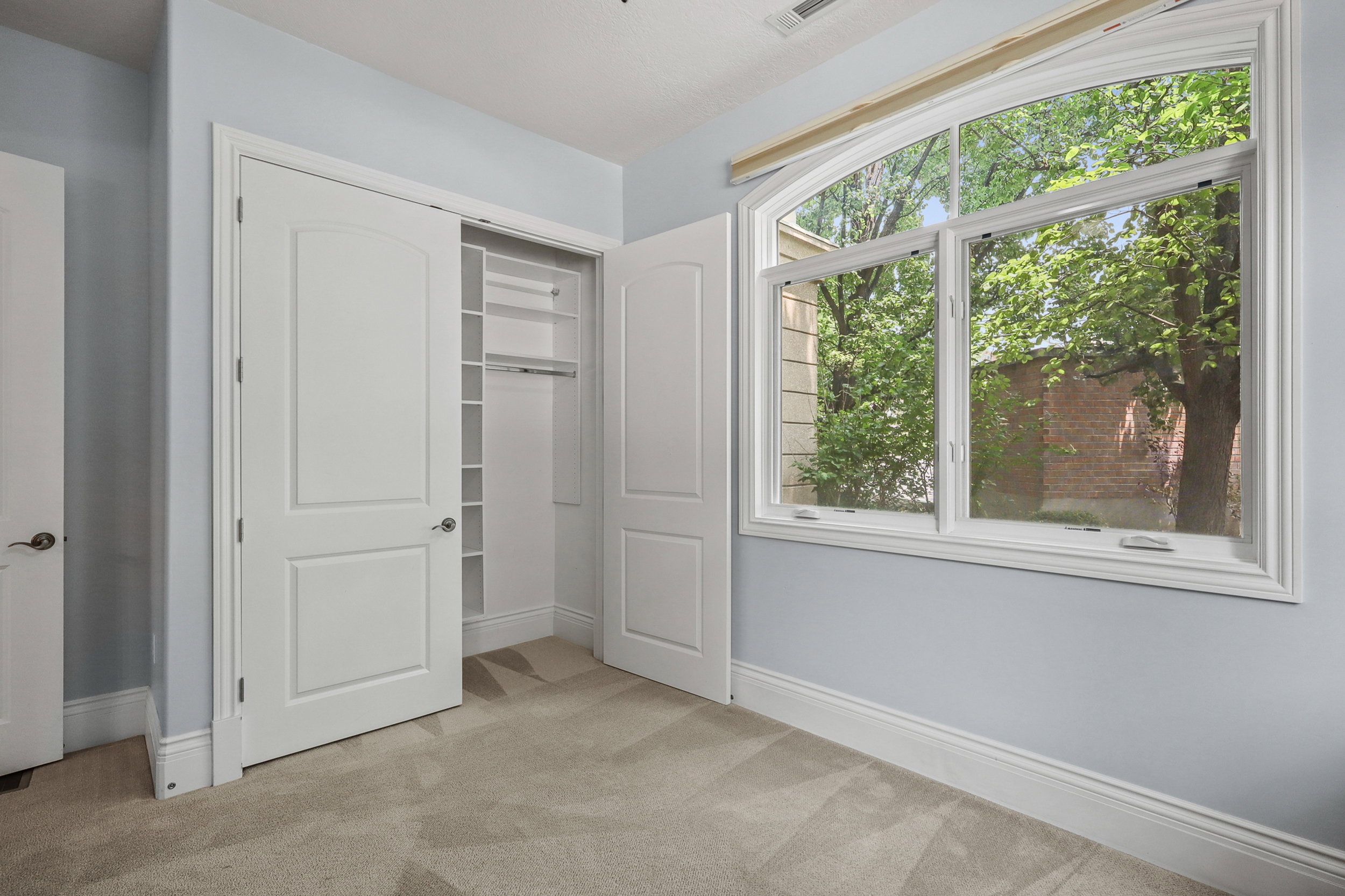 Bedroom #2 with built-in desk and bookshelf