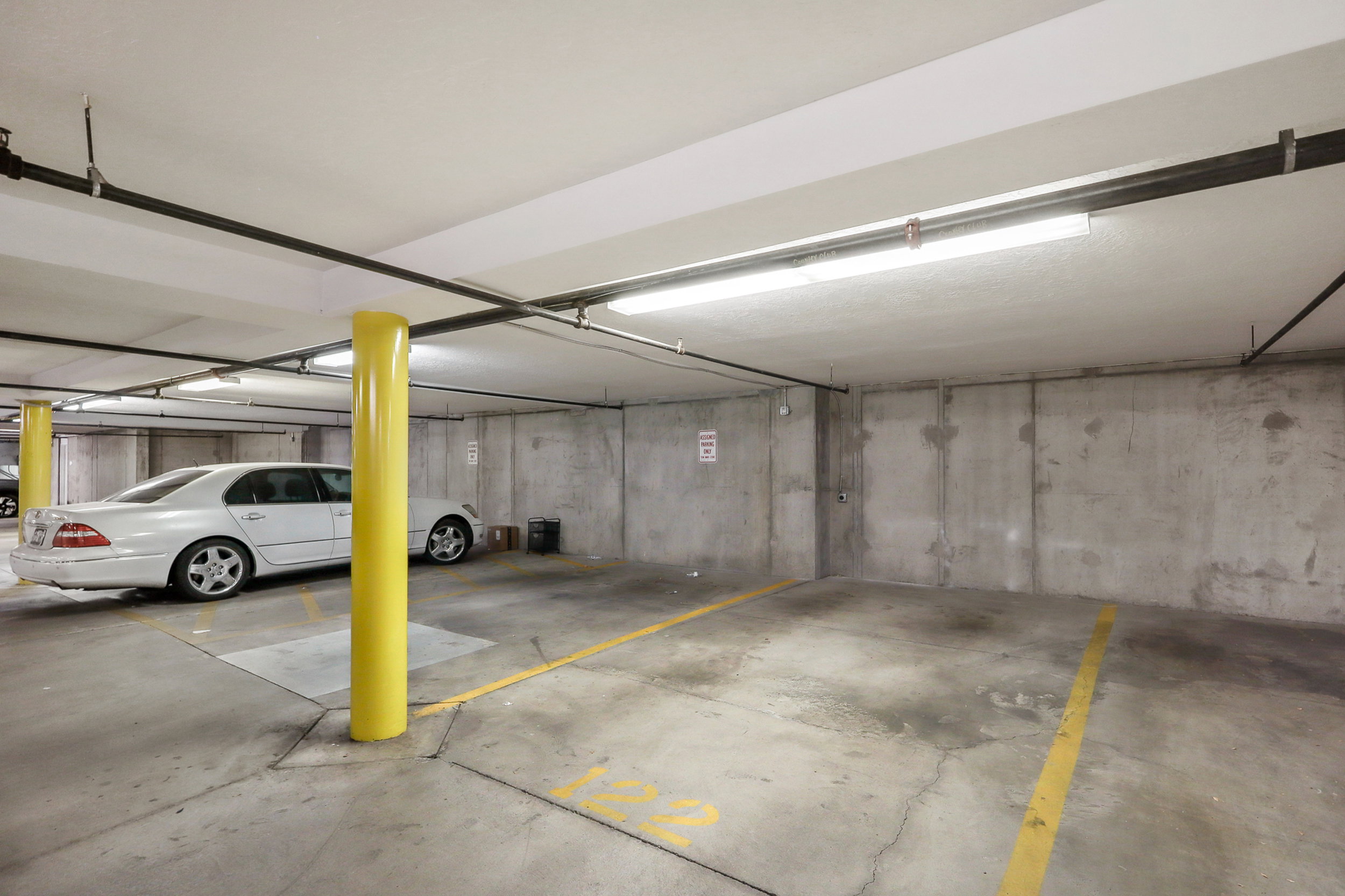 Dedicated underground parking spot with 220V (50 amp) outlet for an EV charging station