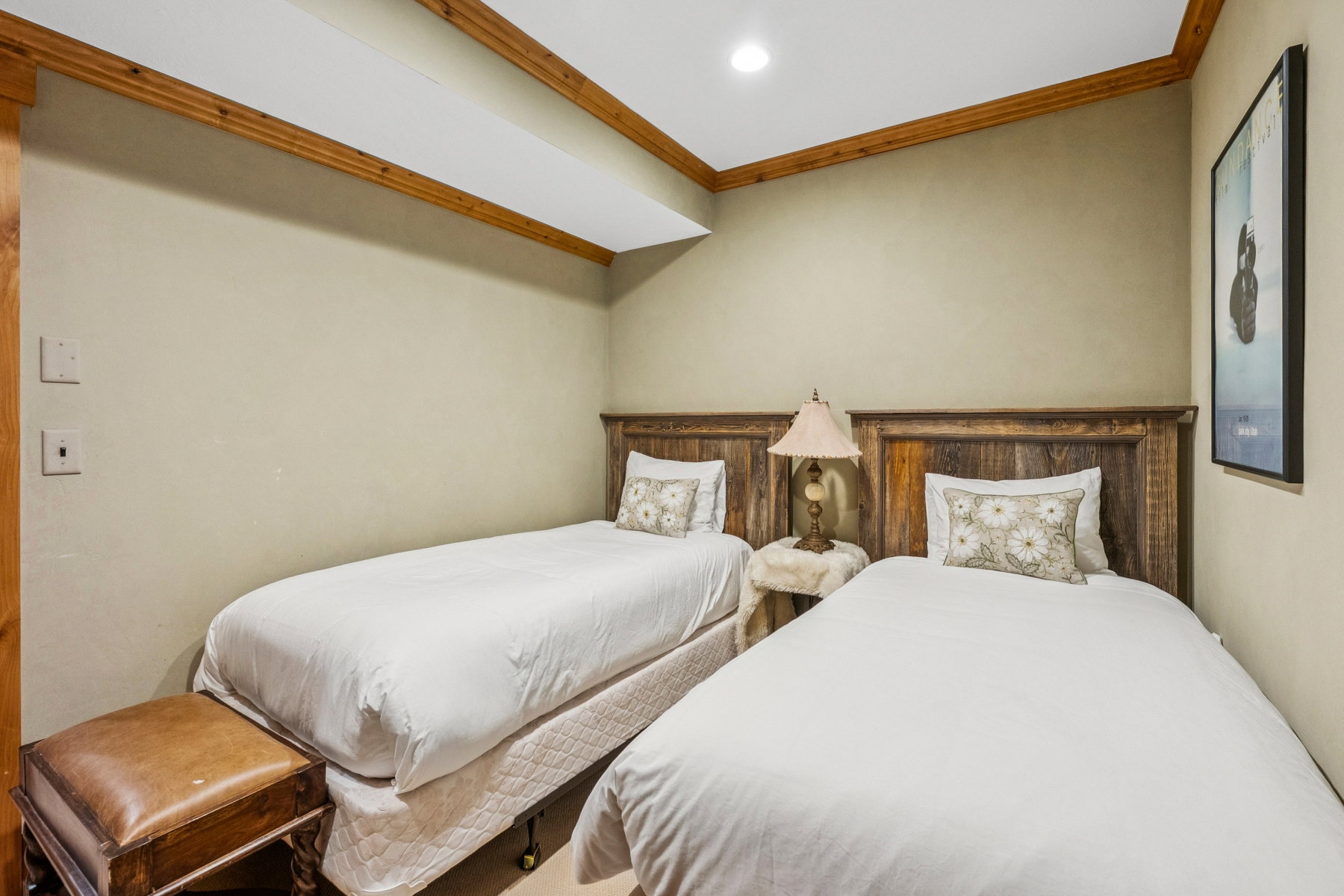 Wood-plank headboards, recessed lighting, and wood trim molding
