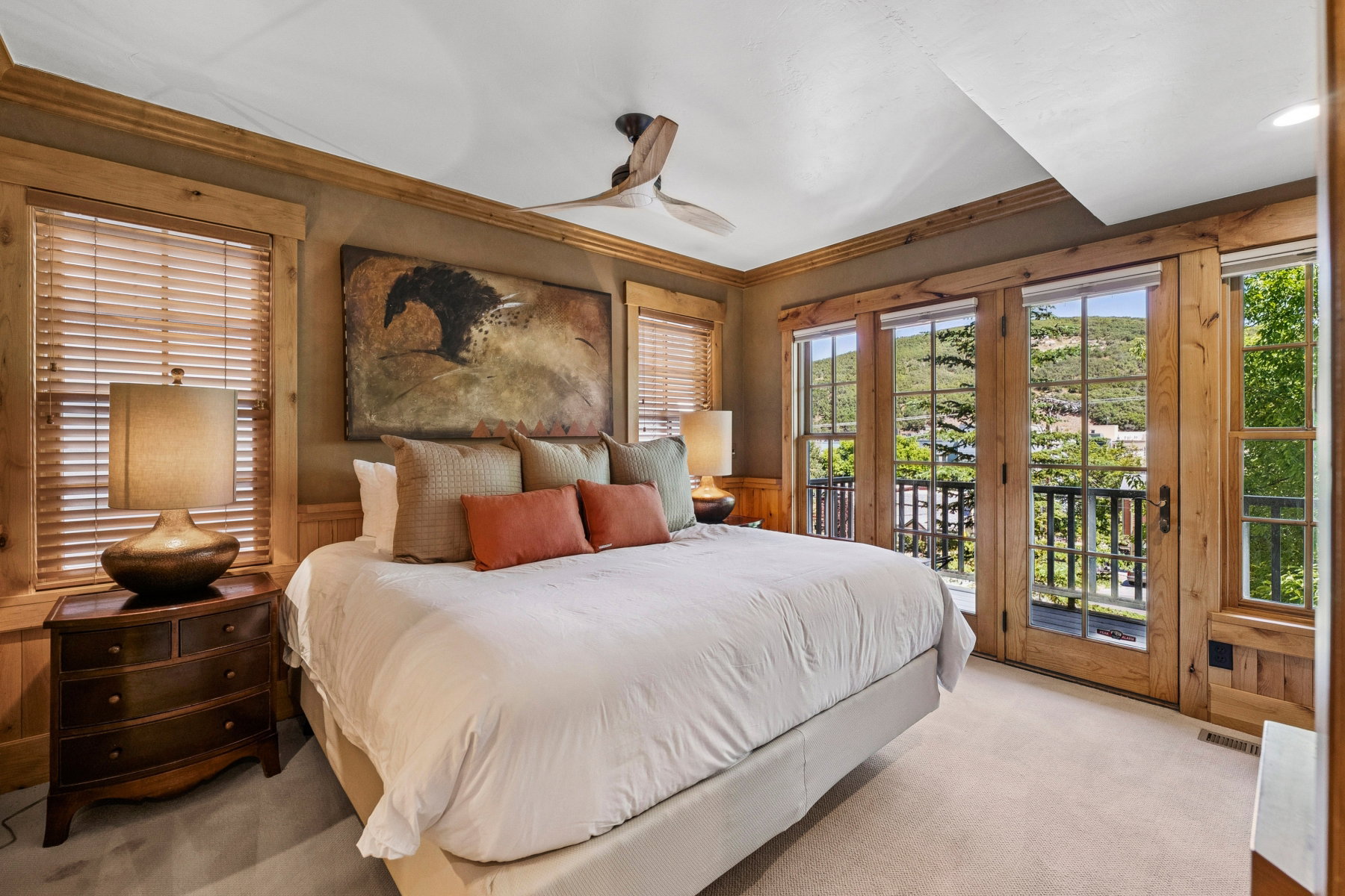 Room featuring wood-finish flooring and a ceiling fan