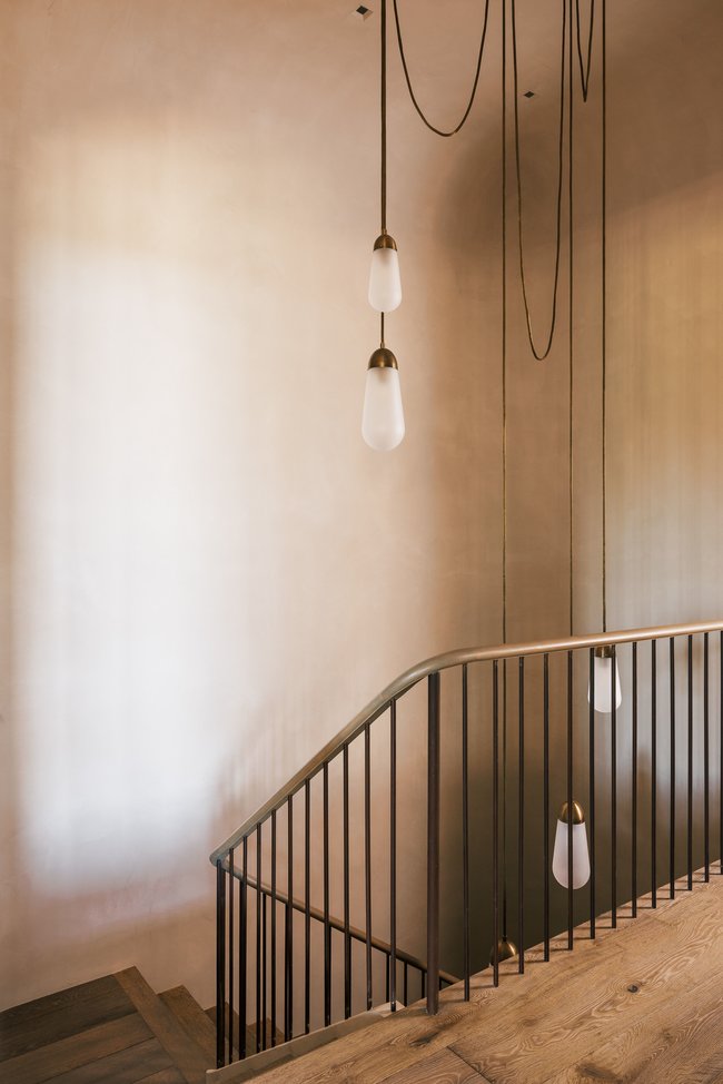 Hardwood stairs with a contemporary metal railing