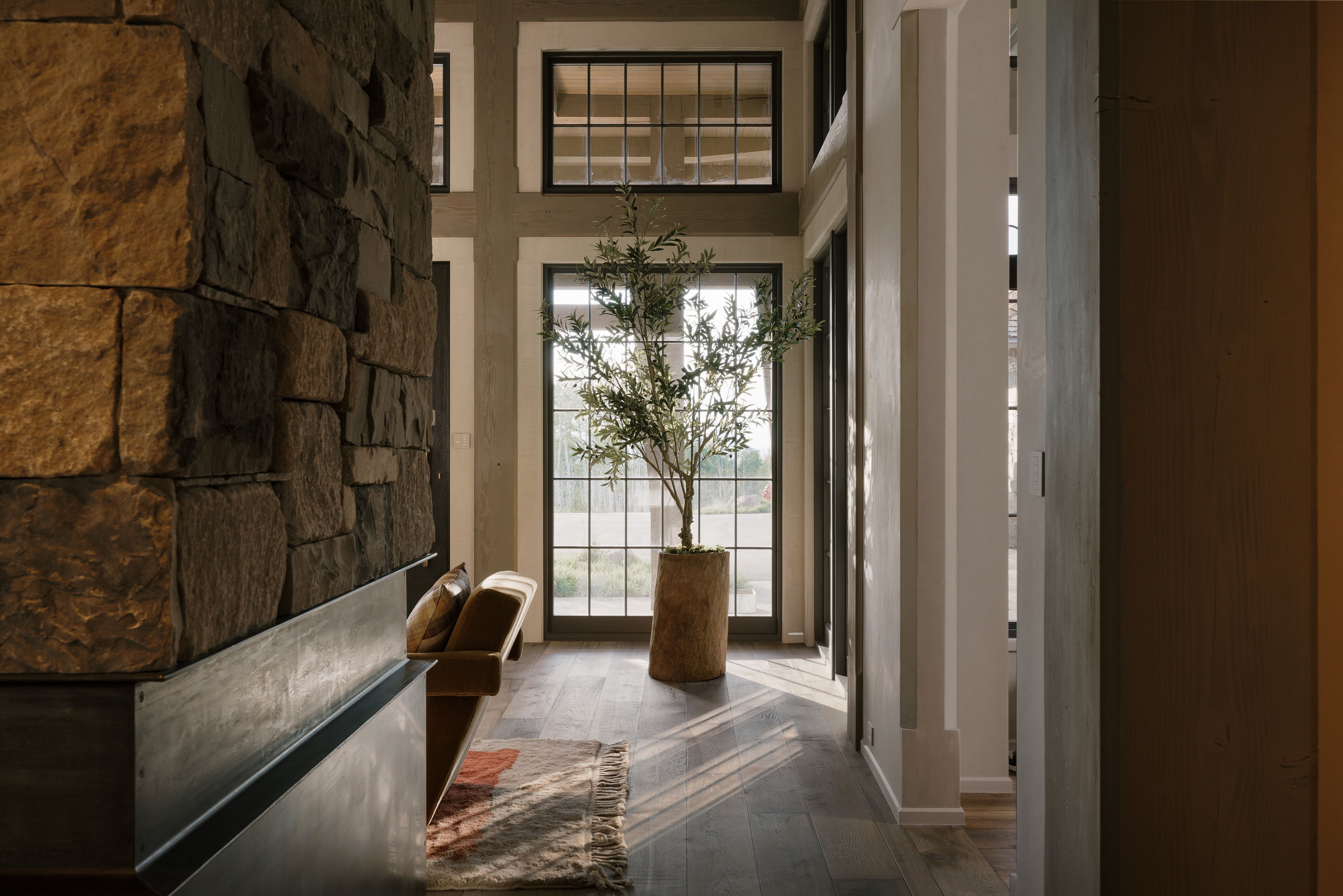 Stone veneer wall with a metal hearth