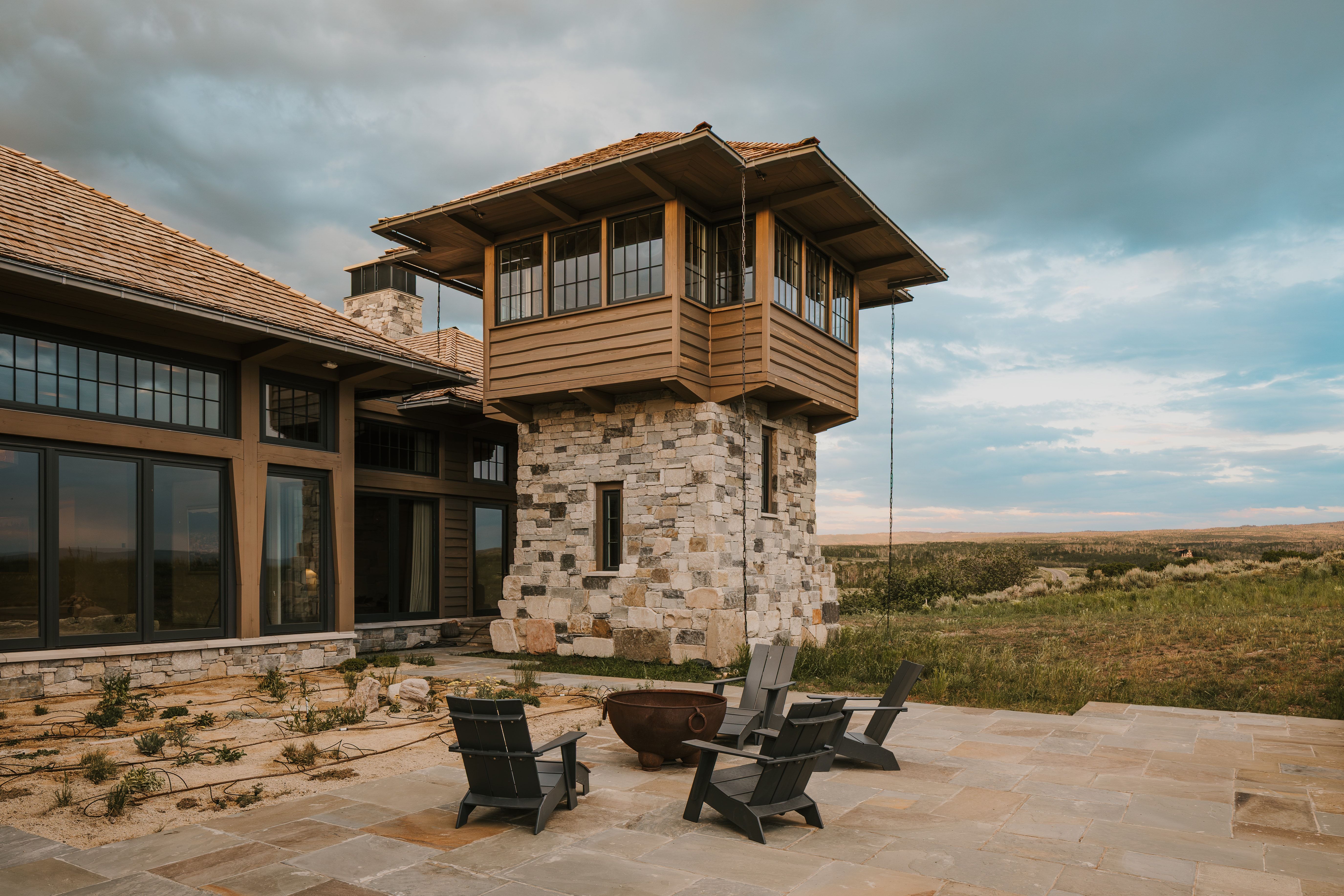 Stone tower accenting a contemporary architectural design