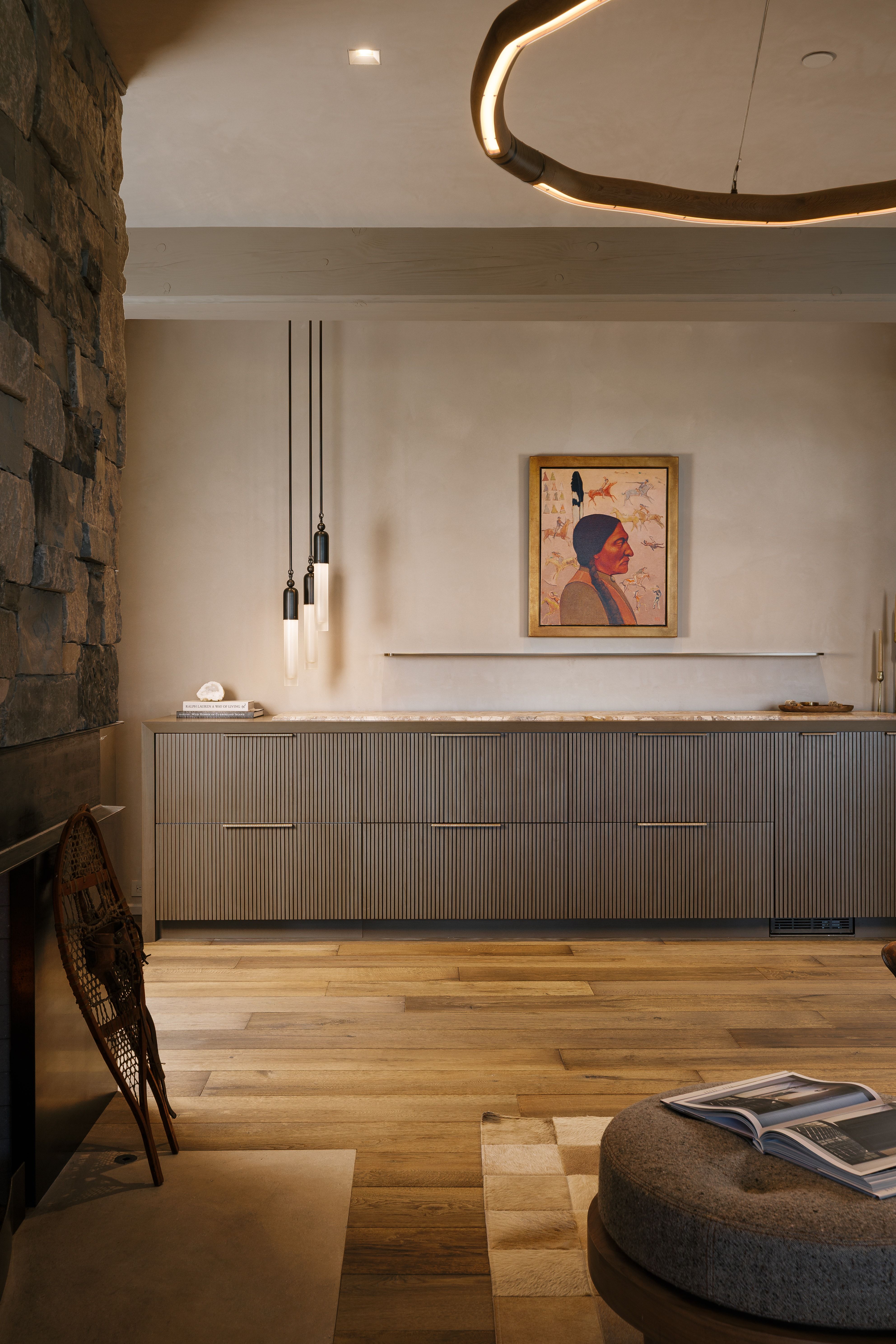 Stacked stone wall accenting wood-finish flooring