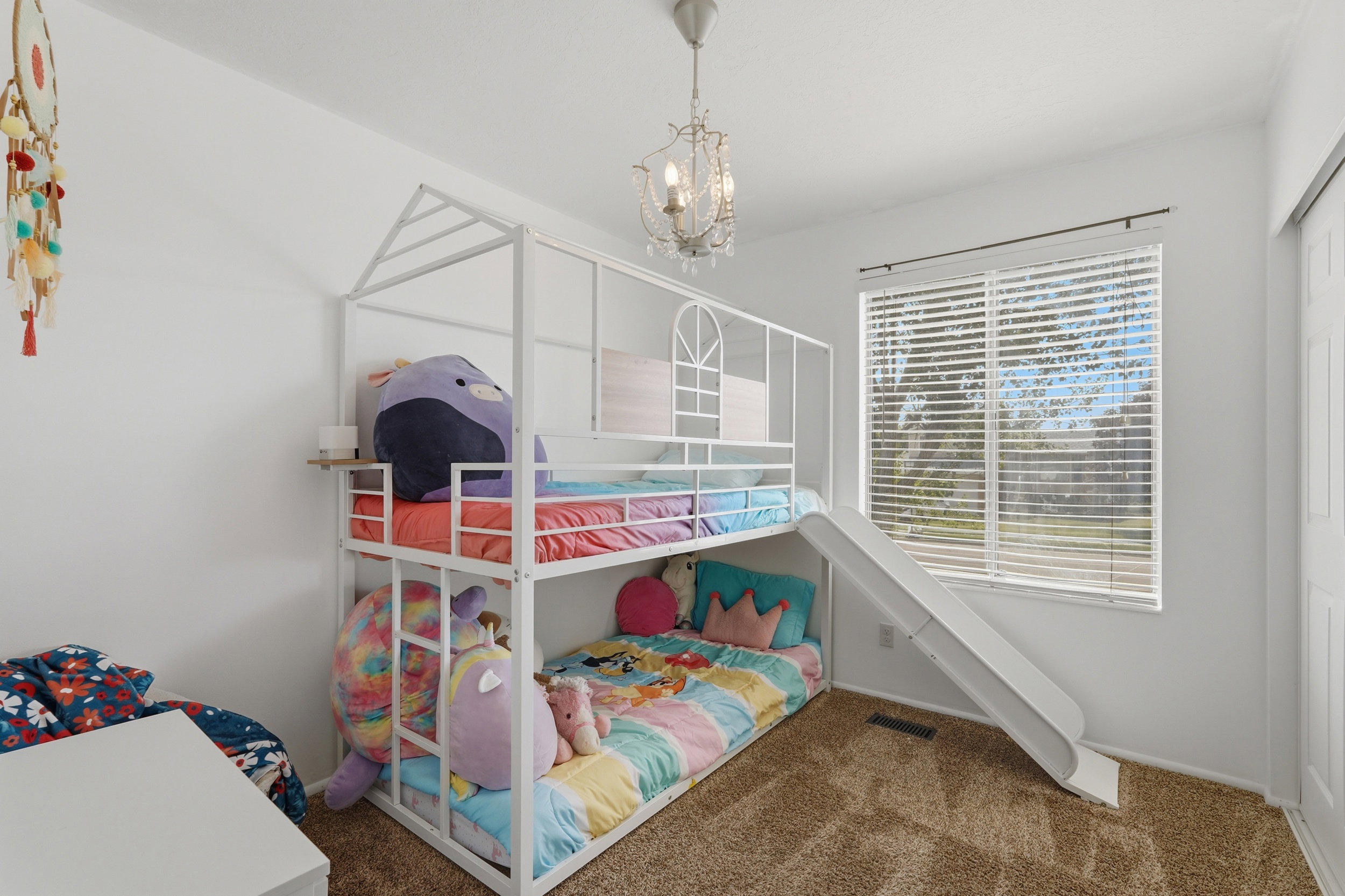 White bunk bed frame with integrated slide