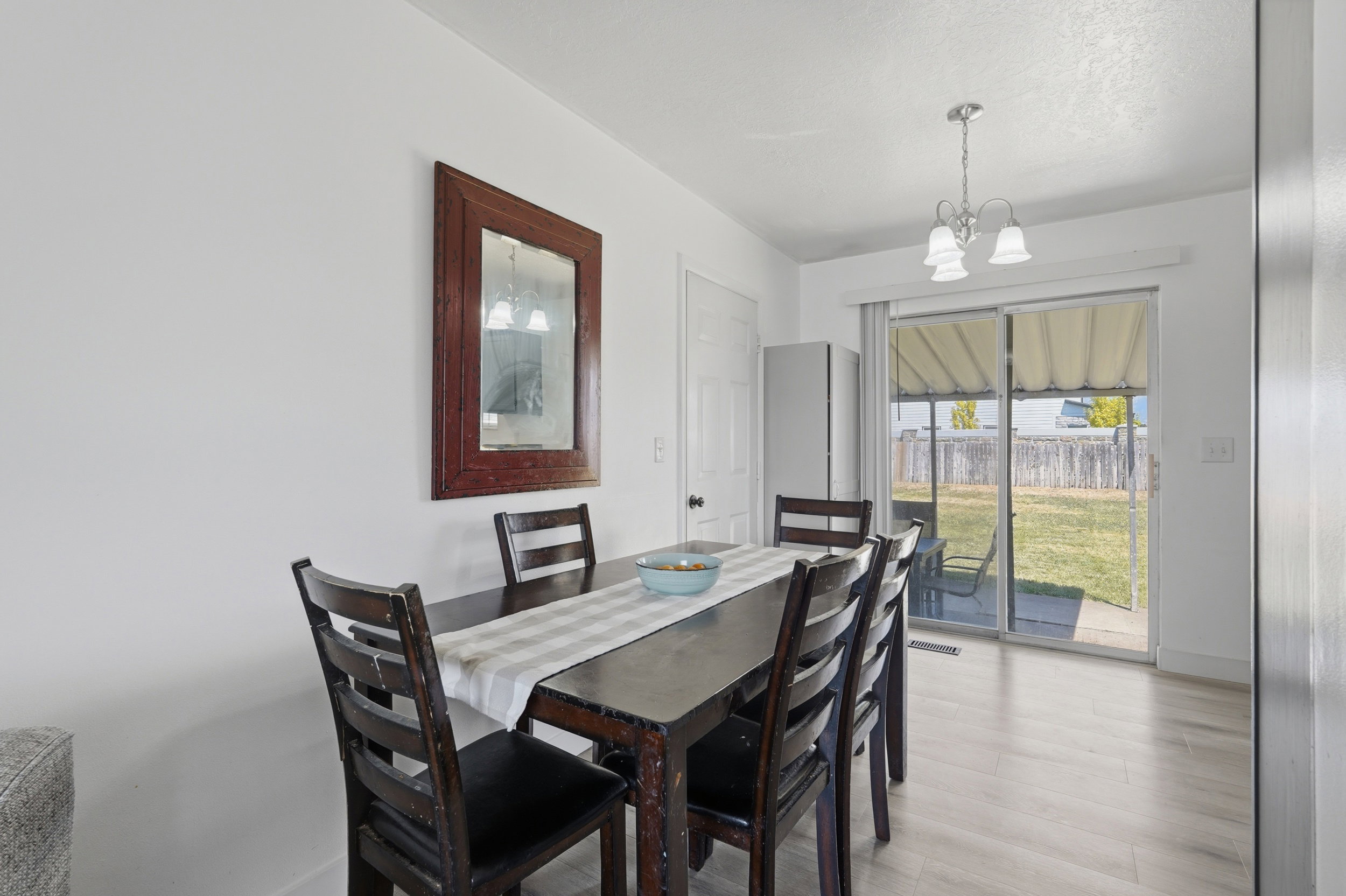 Dining area featuring wood-finish flooring and a white ceiling