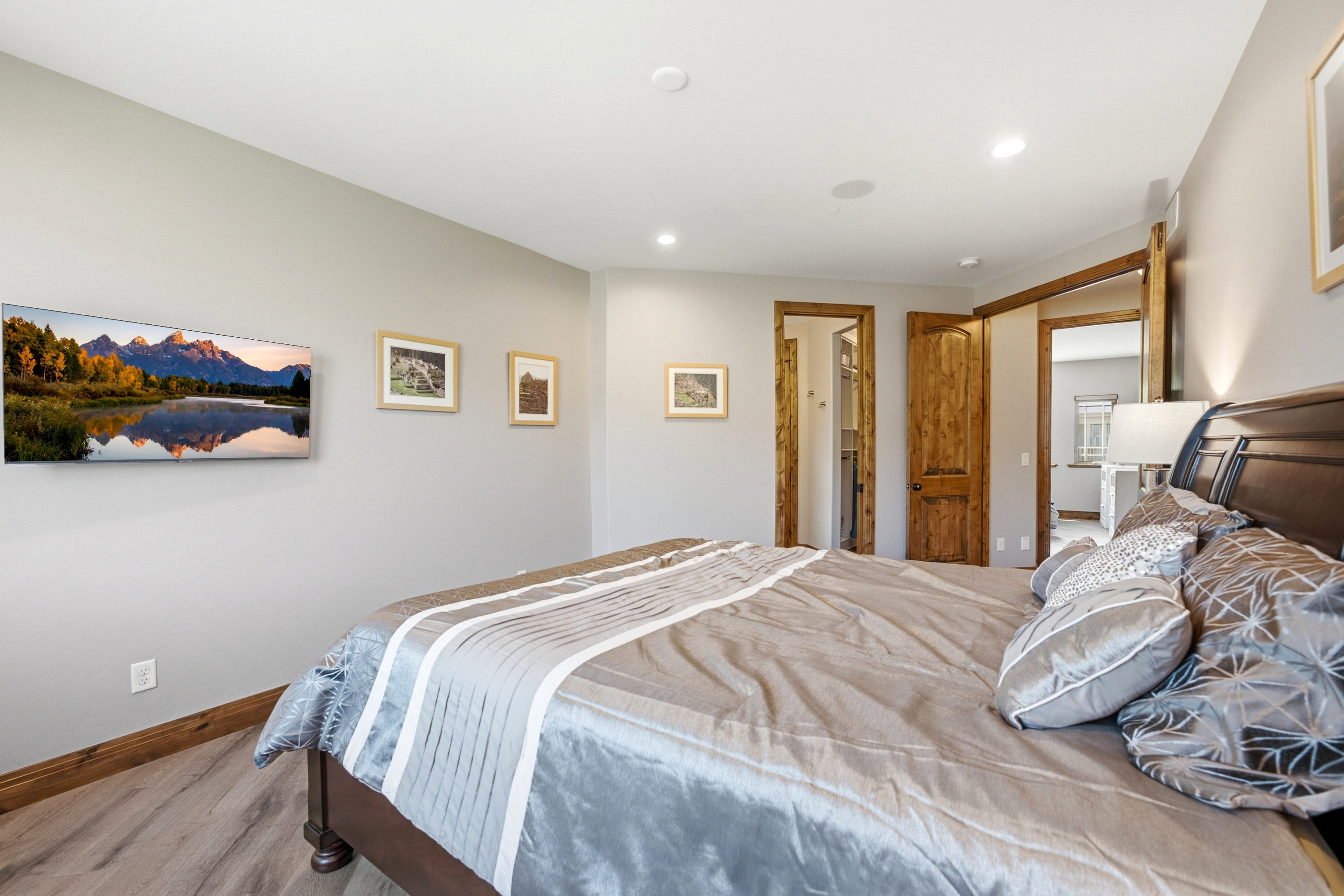 Bedroom featuring wood-finish flooring and light gray walls