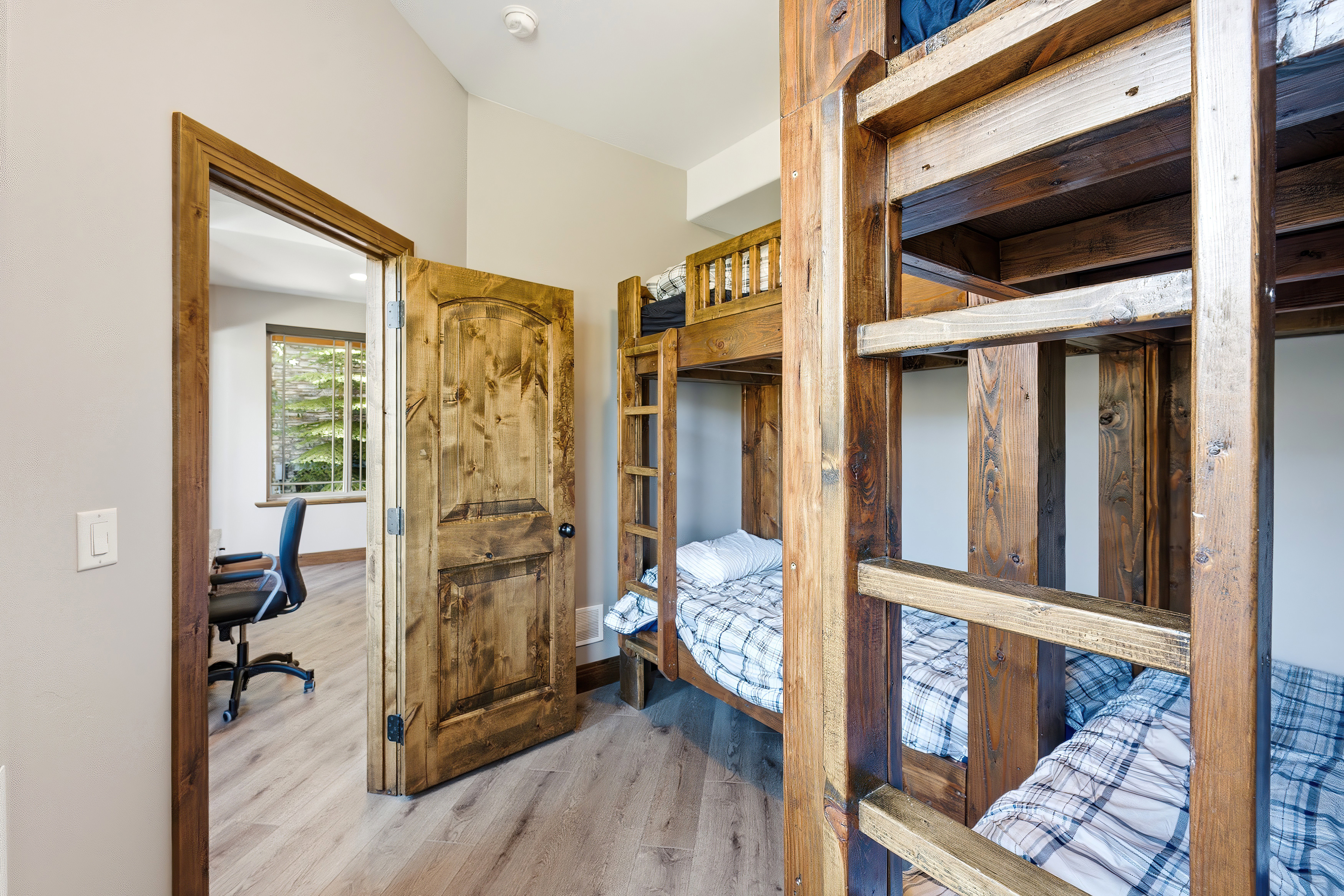 Built-in wooden bunk beds with integrated ladders