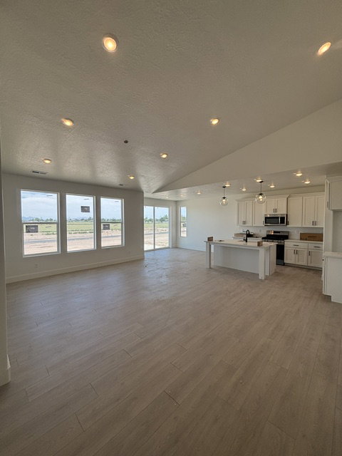 SPACIOUS KITCHEN W/ WHITE CABINETS & QUARTZ COUNTERTOPS!