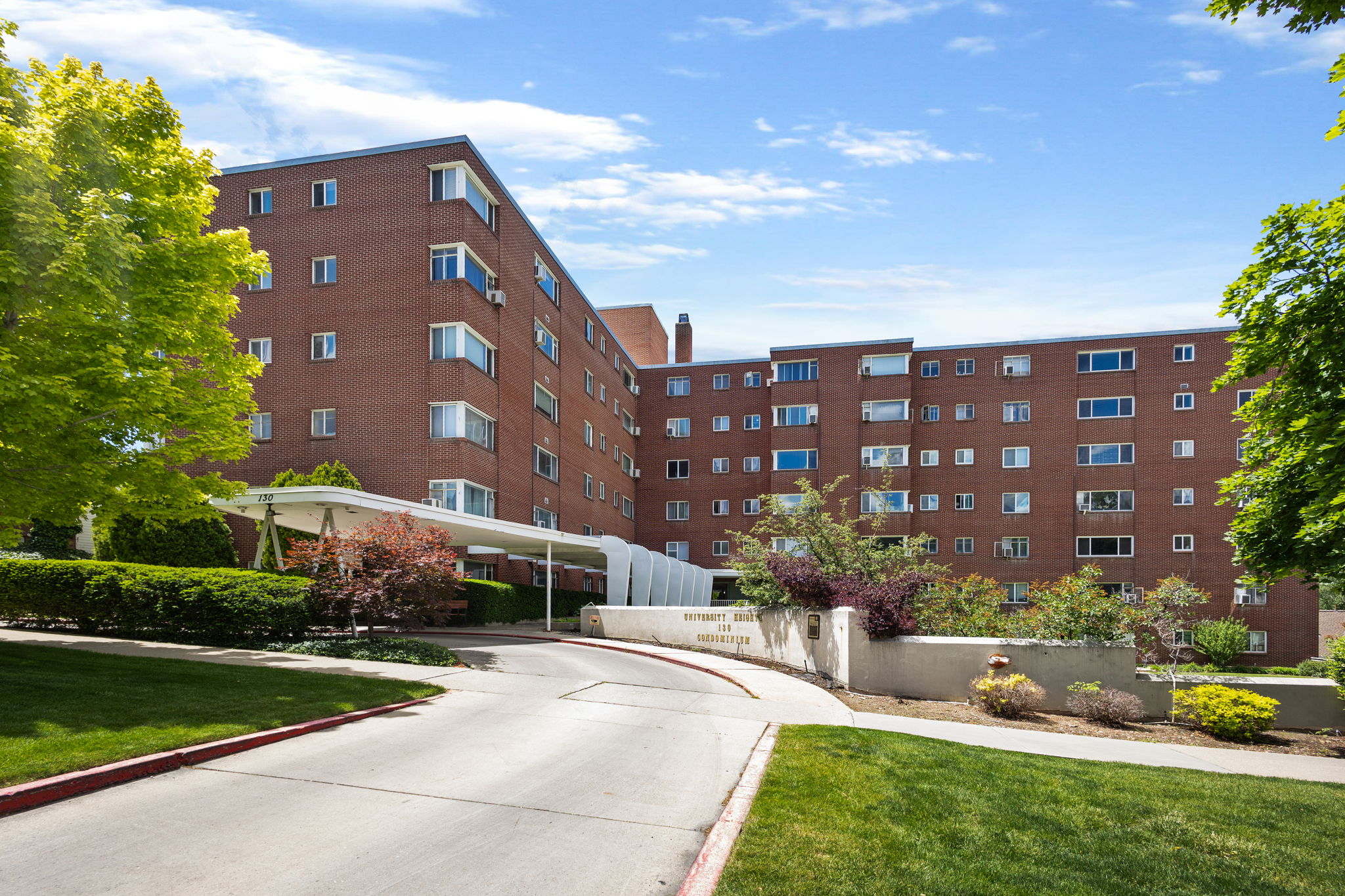 Multi-story brick building with a covered entranceway