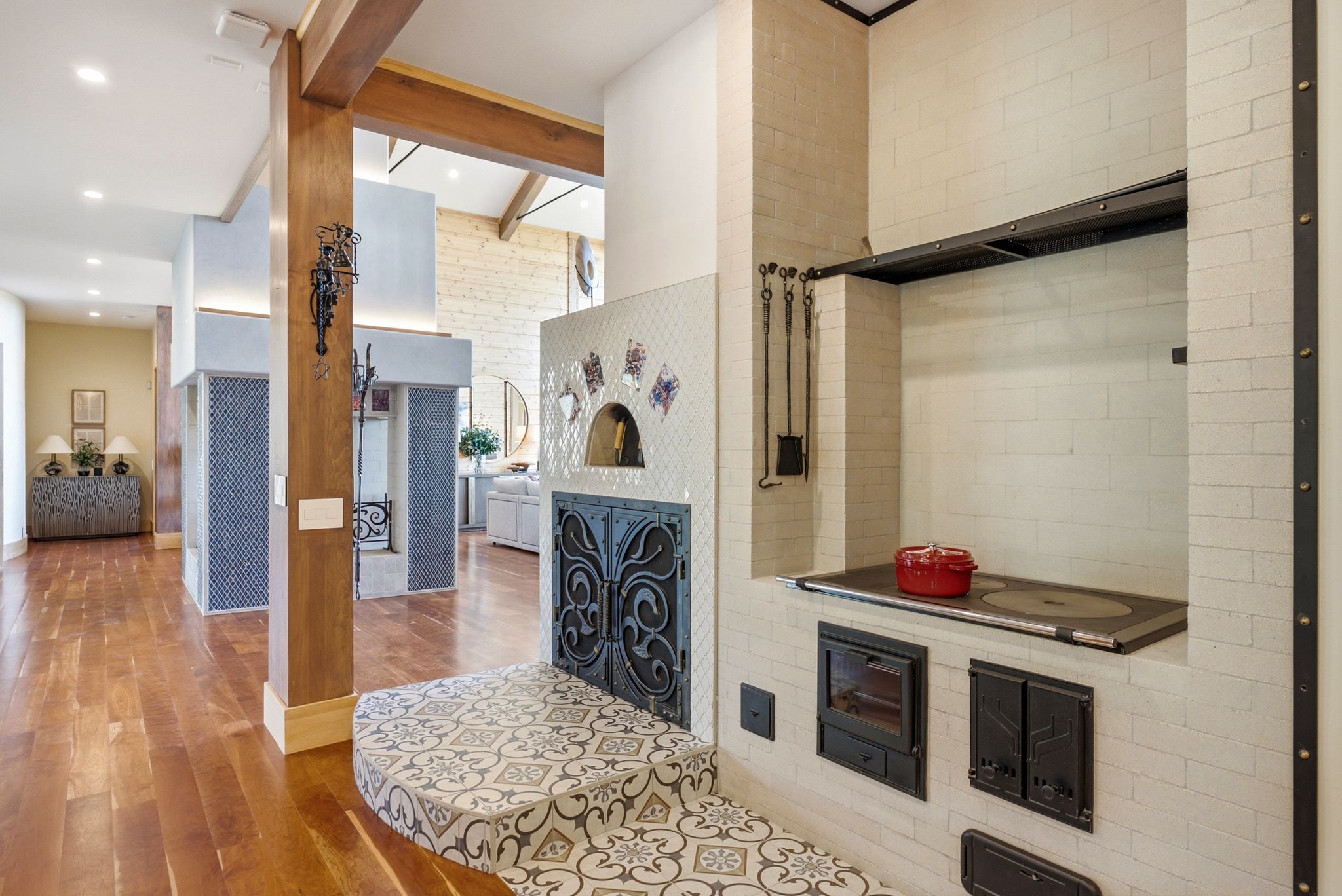 Brick oven with decorative tile surround and cast iron doors