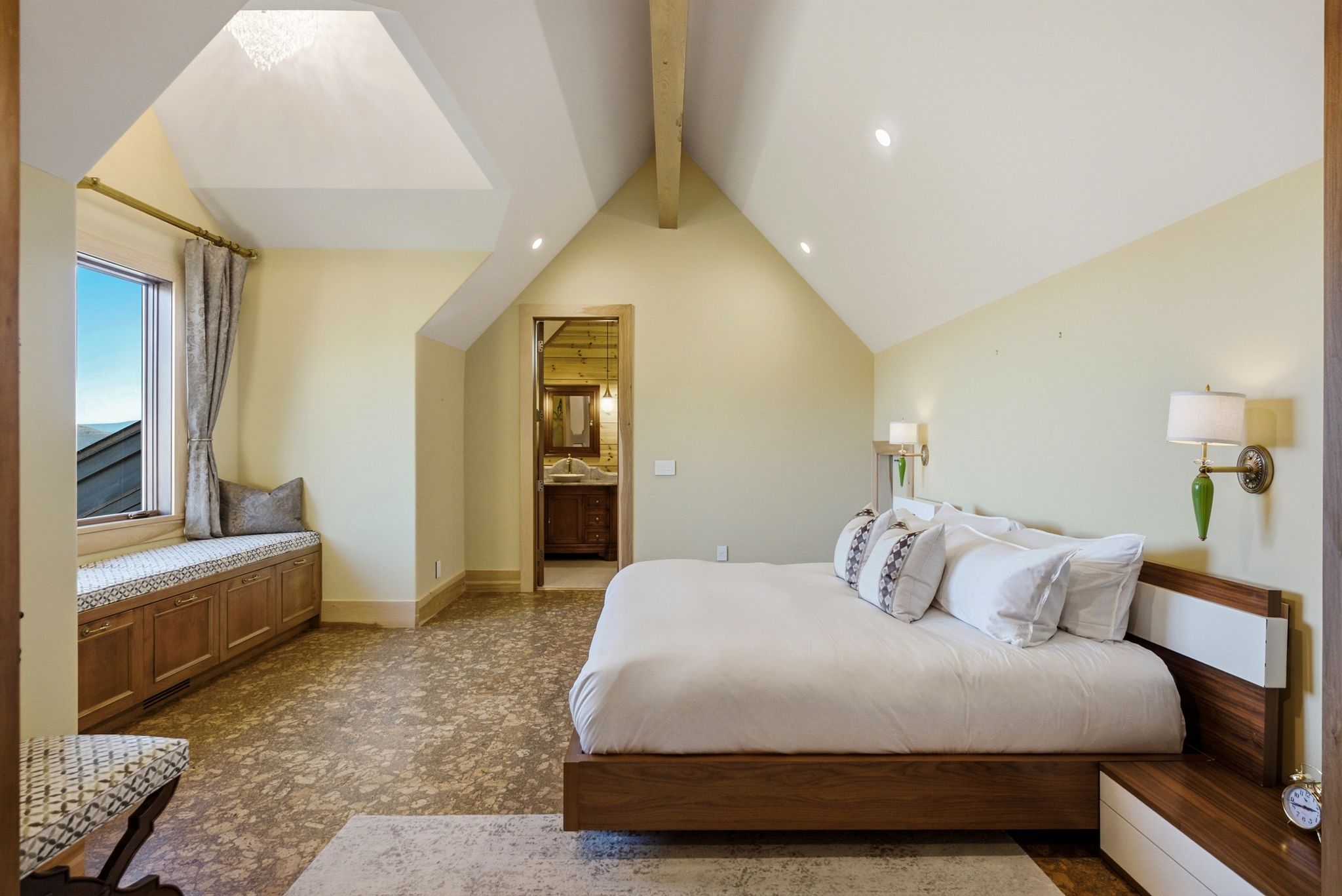 Vaulted ceilings with exposed beam and recessed lighting