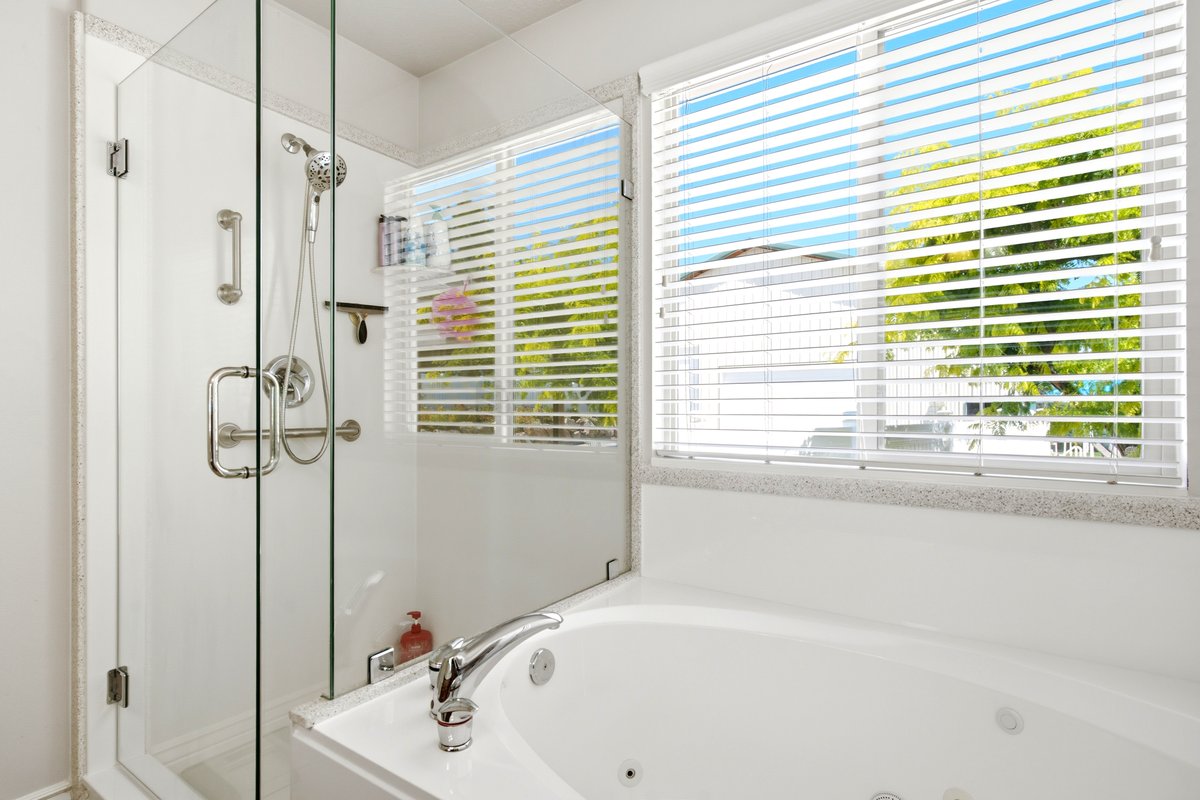 Soaking tub with integrated jets and polished chrome fixtures