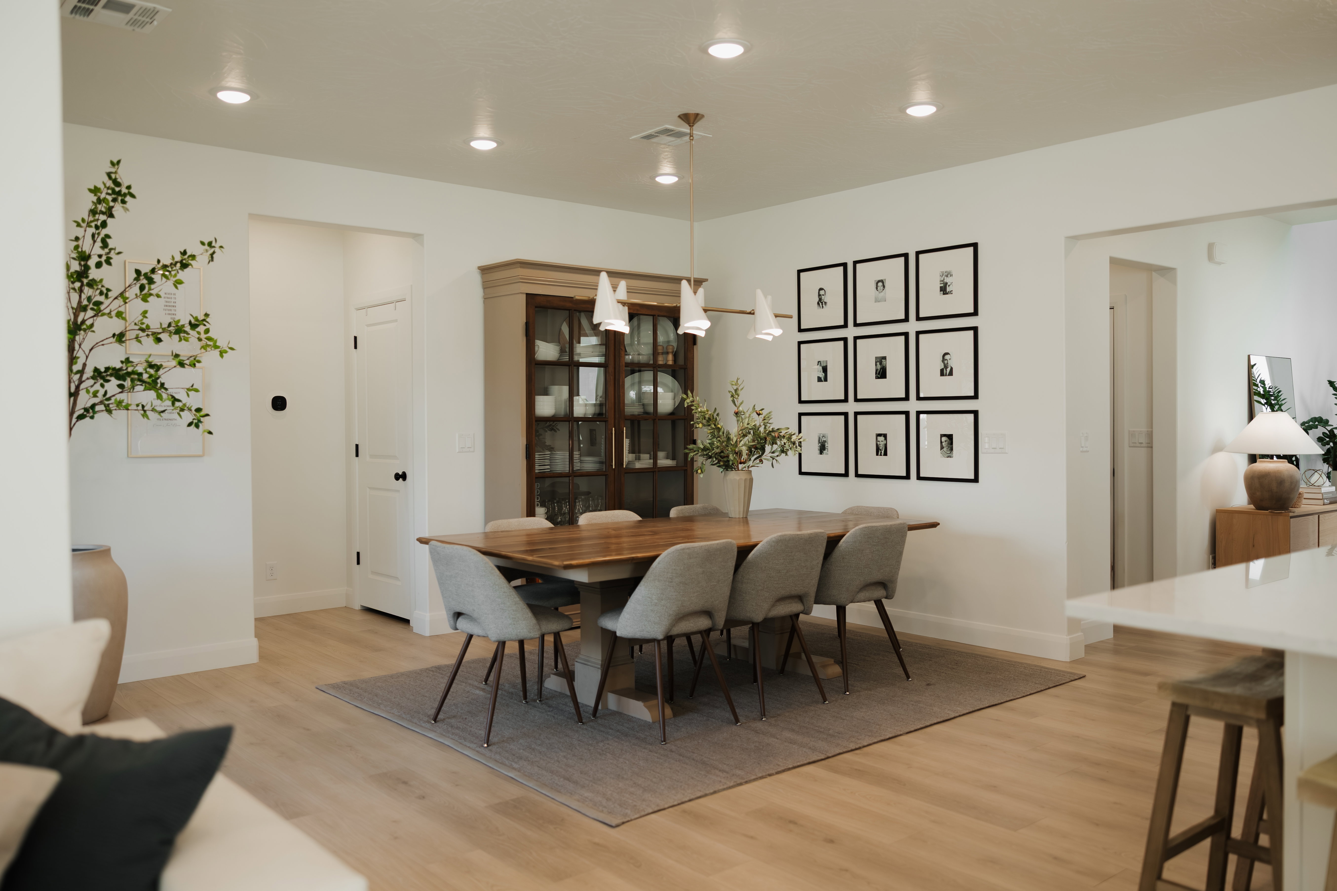 Open-concept dining area featuring light wood-finish flooring and recessed lighting