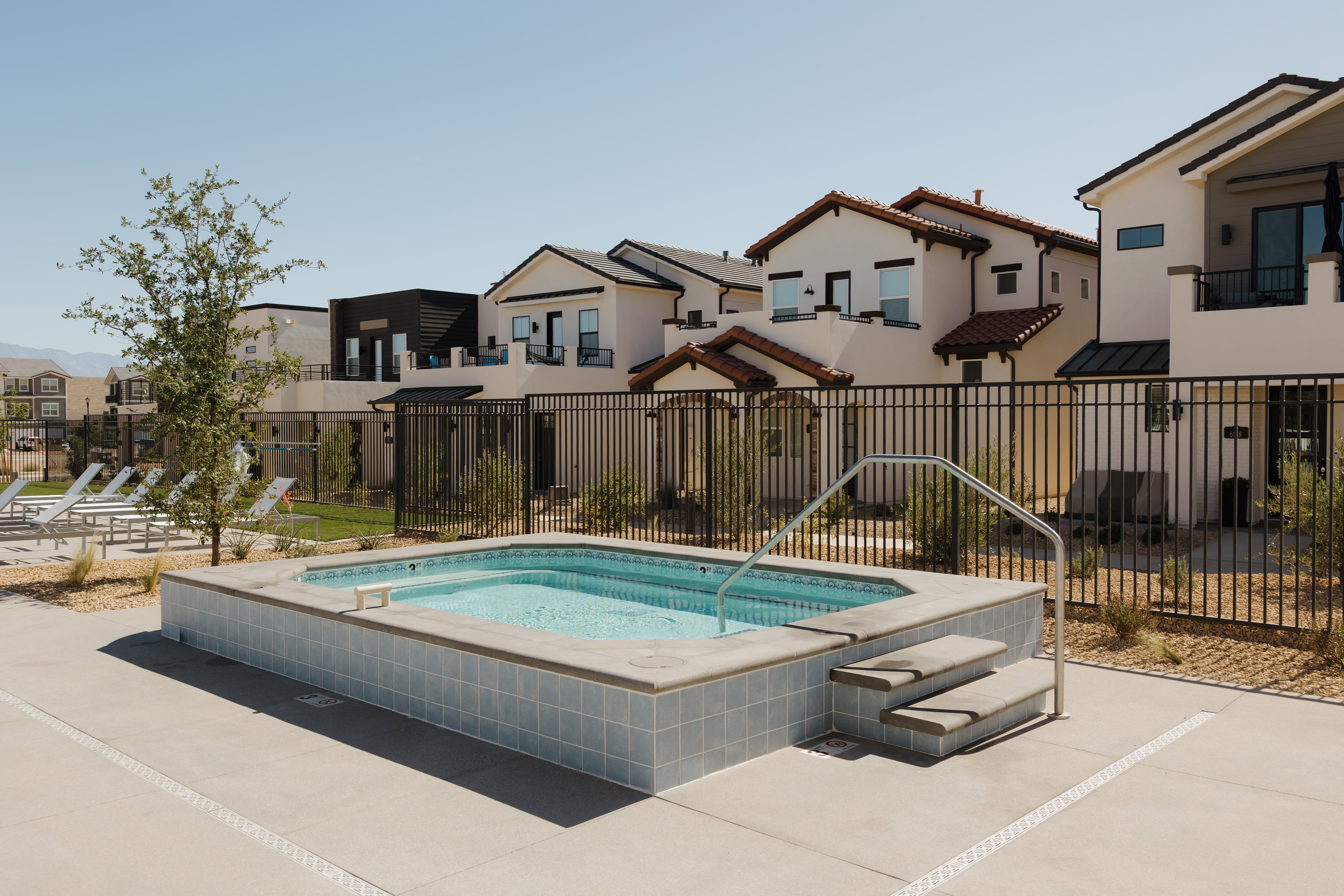 Resident Community spa with tiled exterior and integrated steps