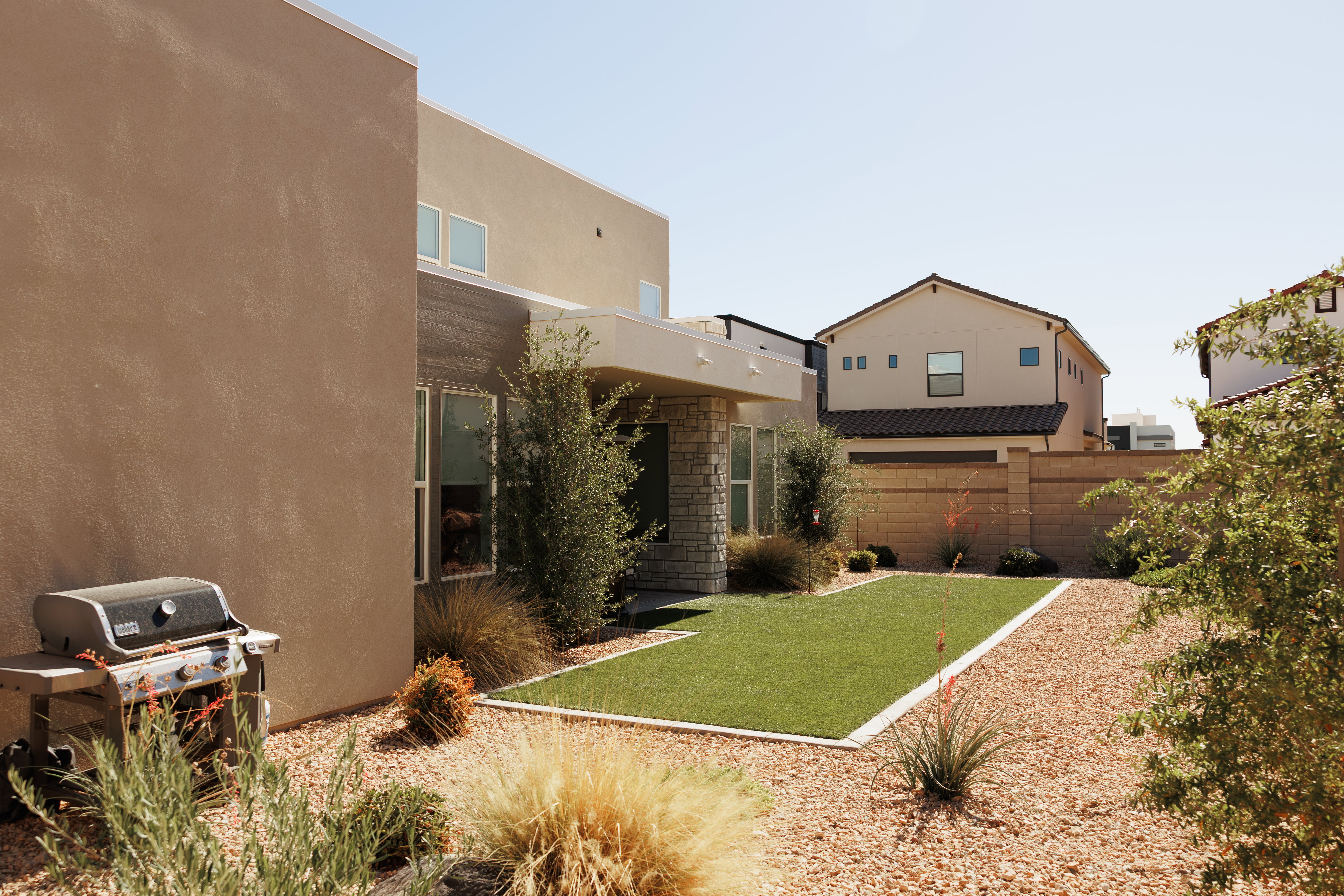 Contemporary exterior featuring stucco and stone accents