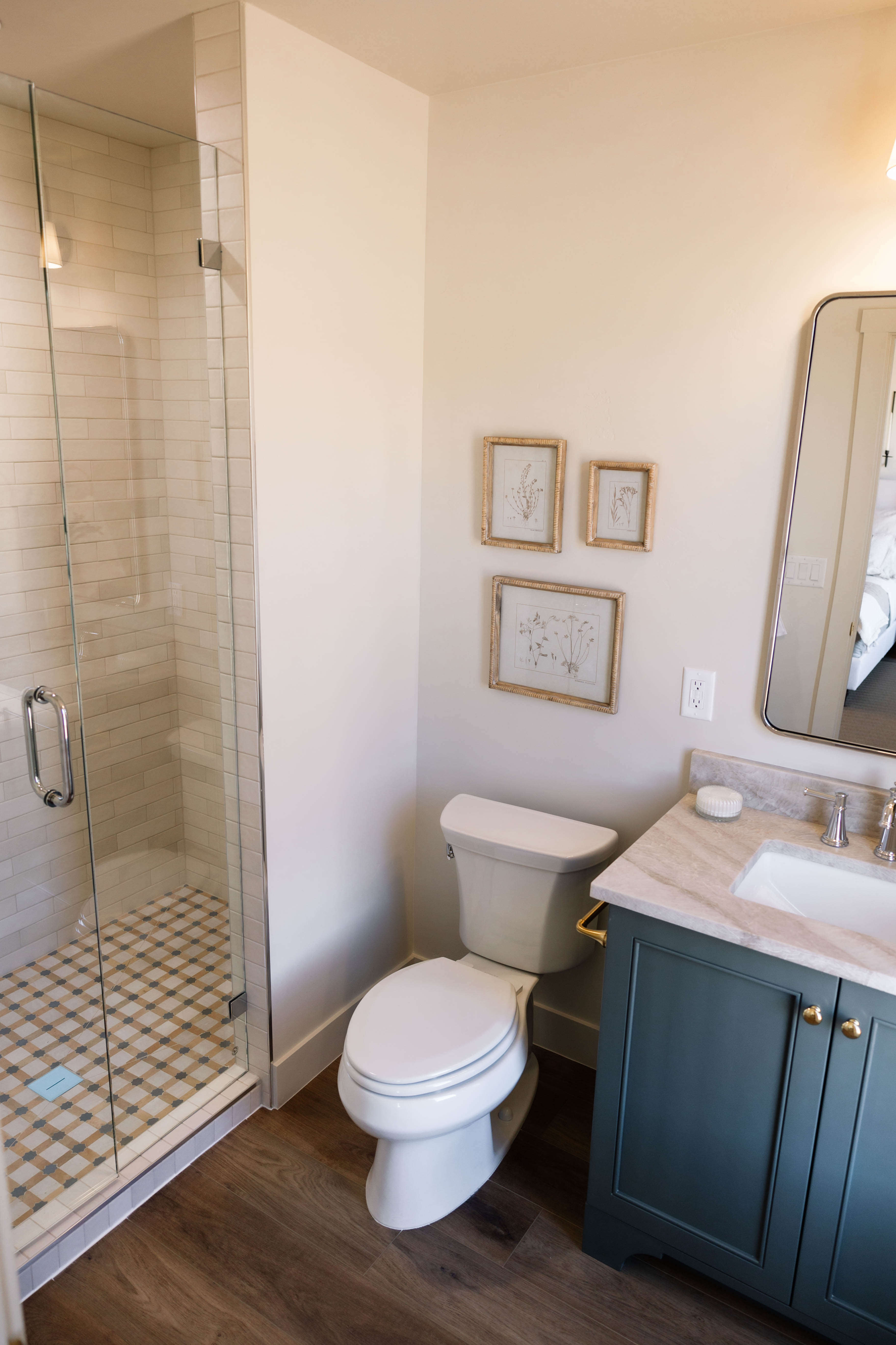Shower with clear glass enclosure and subway tile surround